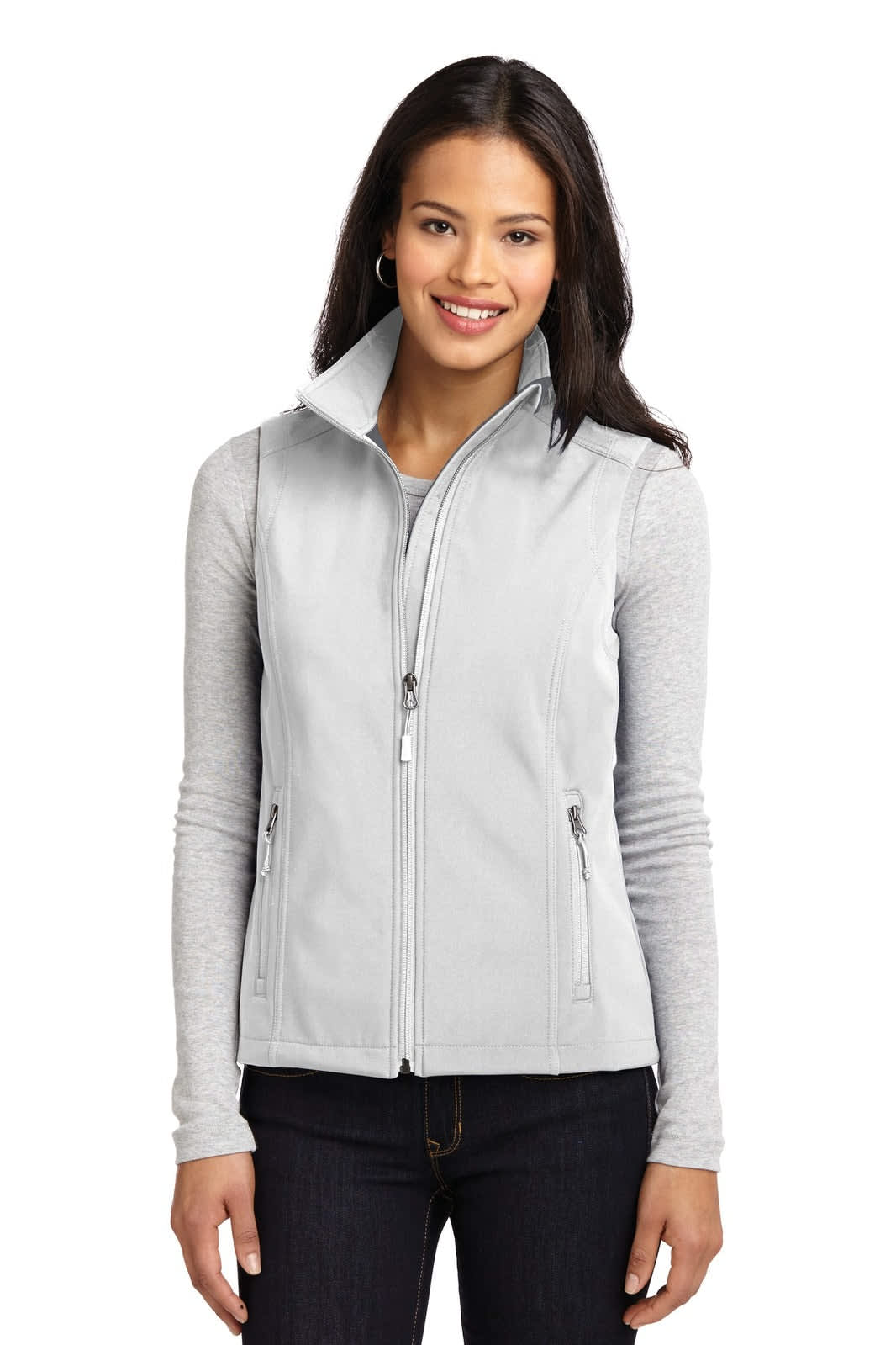 A light grey soft shell vest worn by a woman with long hair, featuring a high collar and zippered front.