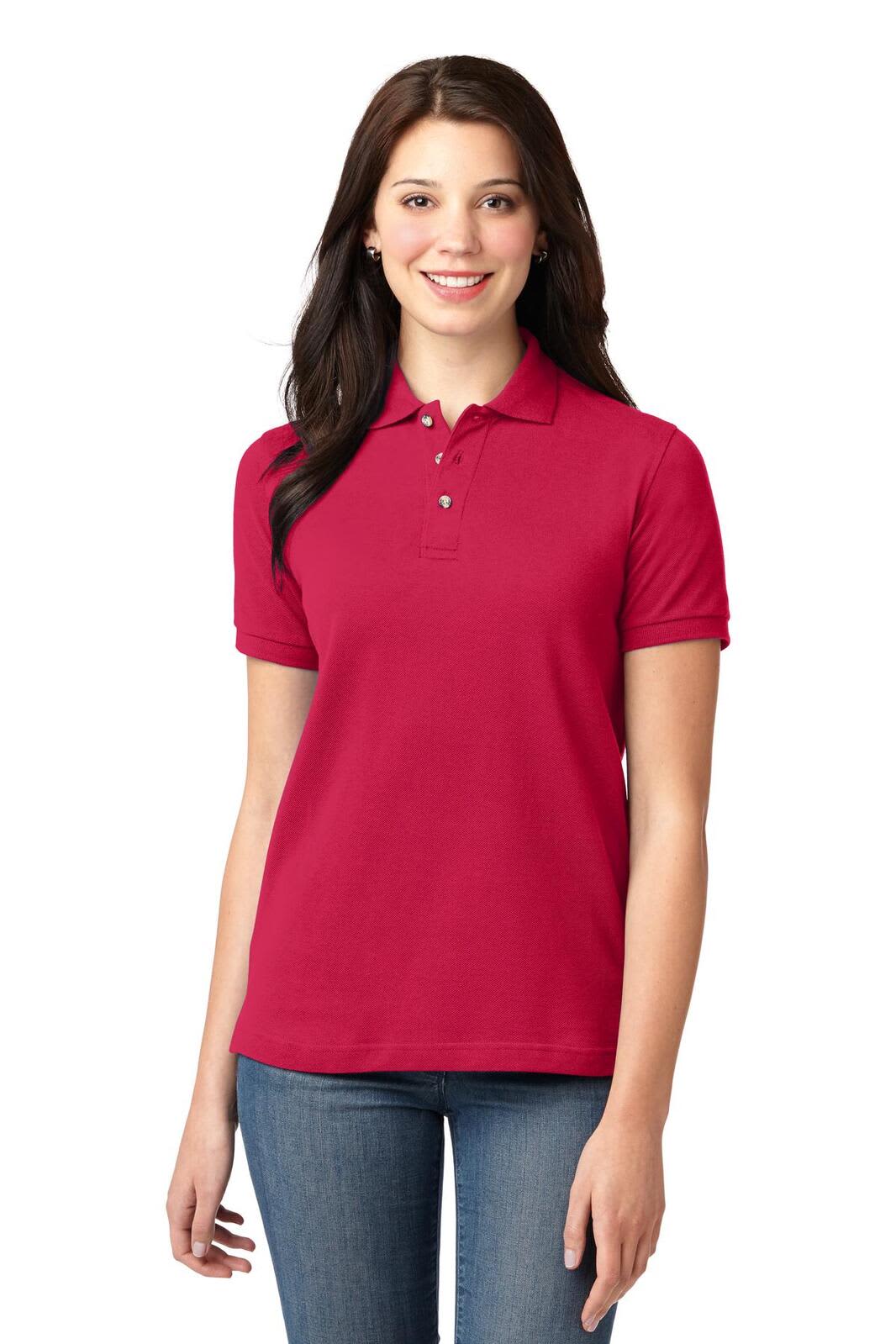 A red ladies' heavyweight cotton pique polo shirt with a collar, featuring a logo. Model is wearing it with jeans.