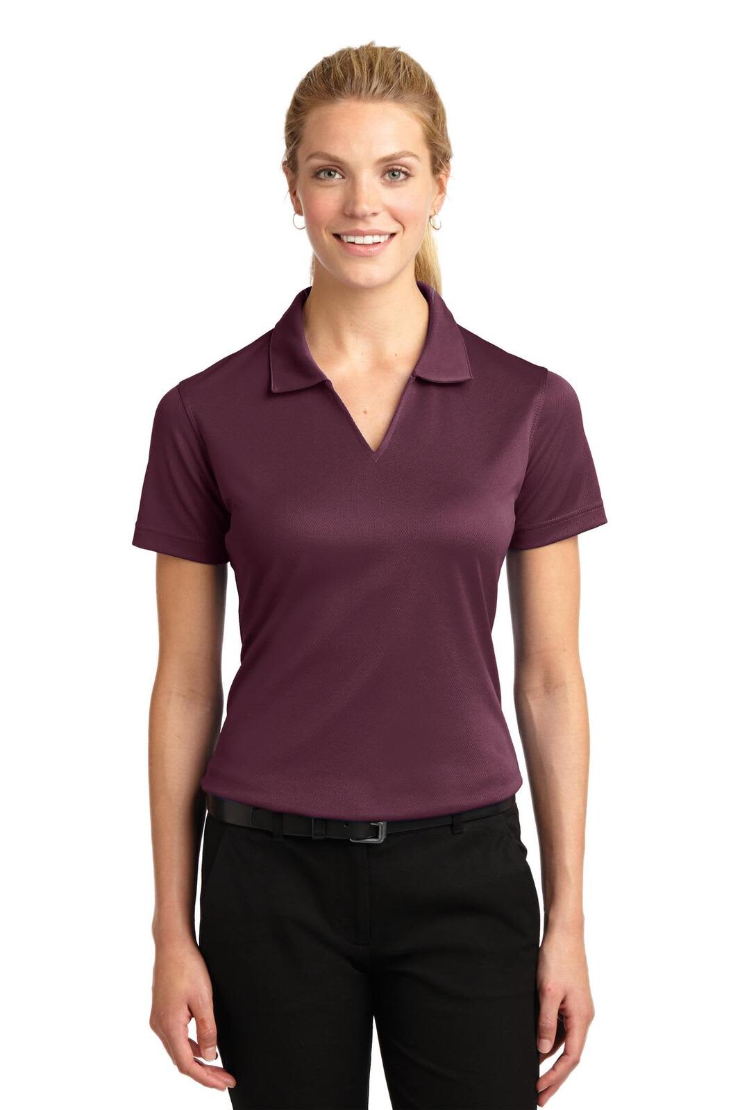 A maroon Ladies Dri-Mesh V-Neck Polo shirt featuring a collar and short sleeves, worn by a model.