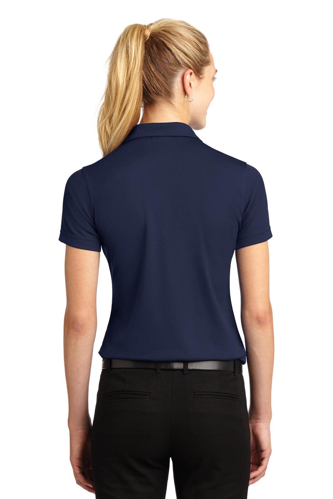 A navy blue Sport-Tek ladies' Dri-Mesh V-neck polo shirt with a logo on the collar, viewed from the back.