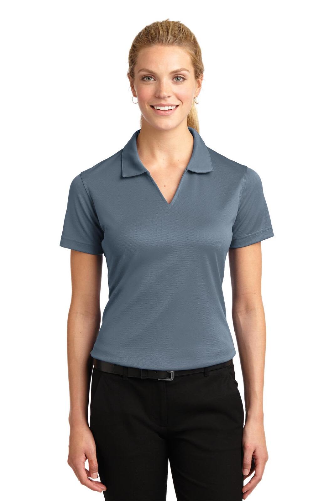 A grey Sport-Tek ladies Dri-Mesh V-neck polo shirt with a collar, paired with black trousers.
