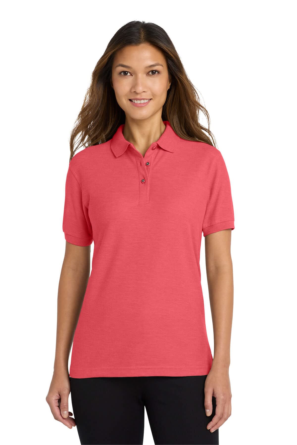 A coral pink ladies' polo shirt with a collar, featuring a logo on the sleeve.