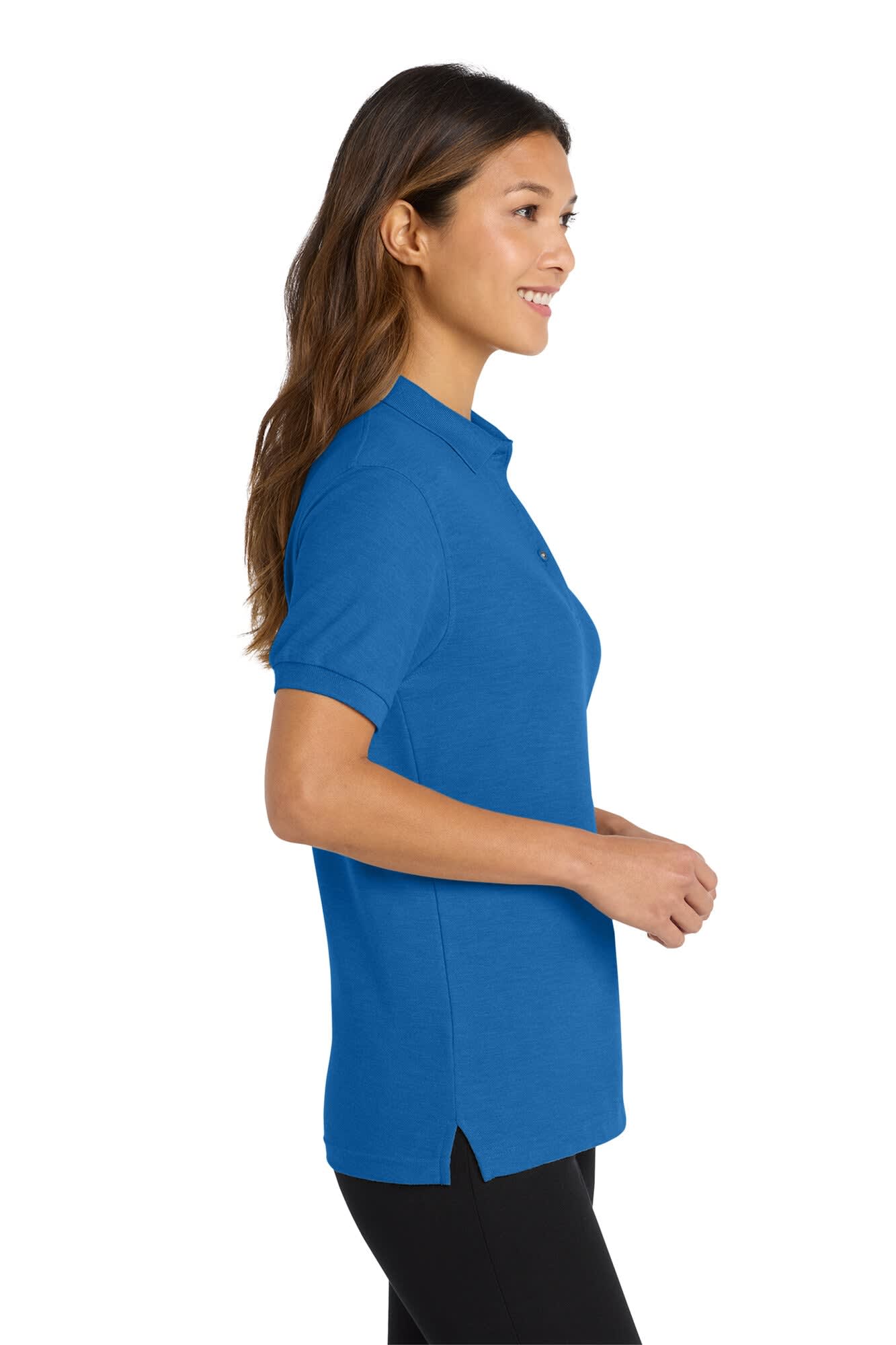A blue women's polo shirt with a collar, featuring a logo, shown on a model from the side.