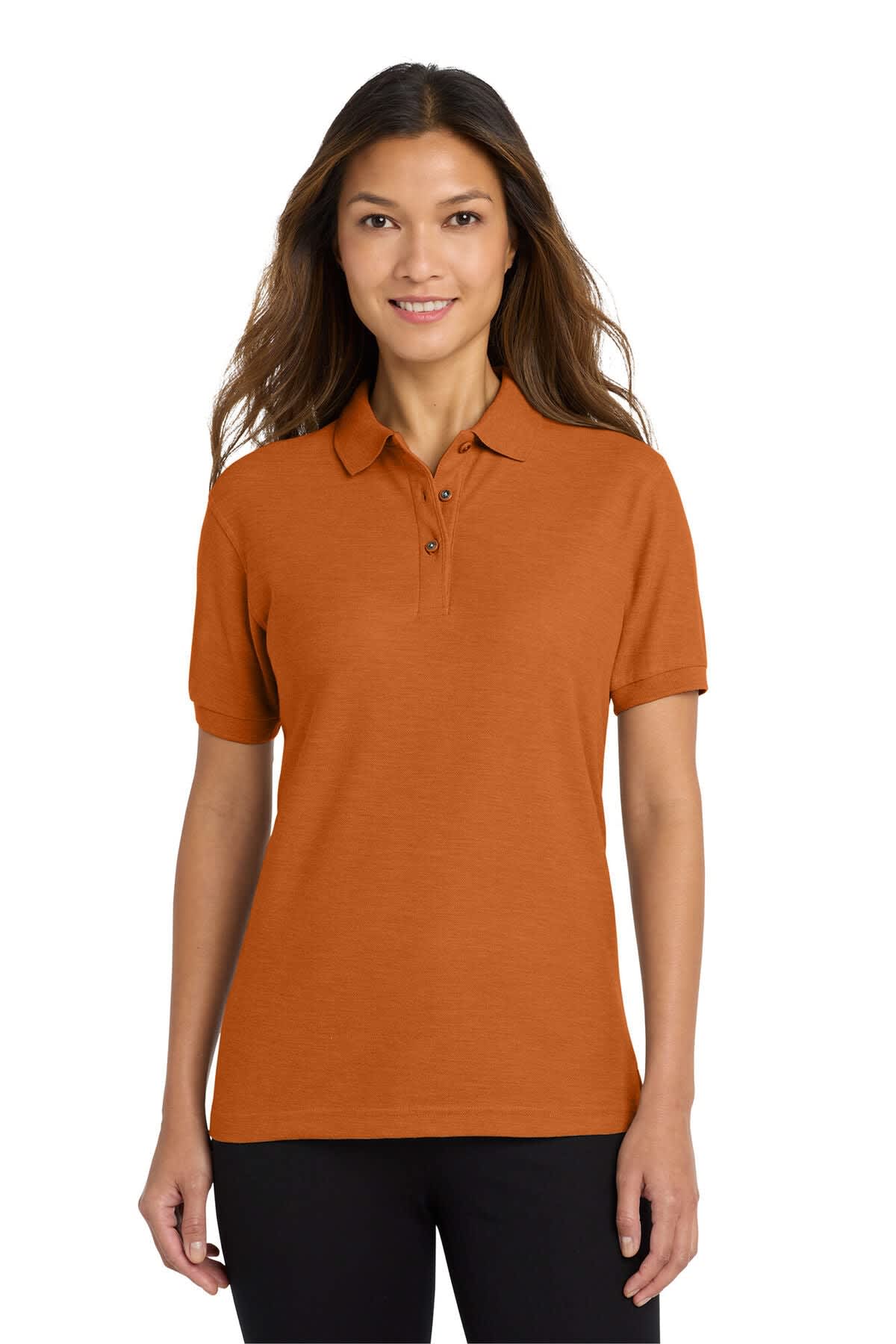 A woman wearing an orange polo shirt with a collar and buttons. The shirt features a logo on the chest.