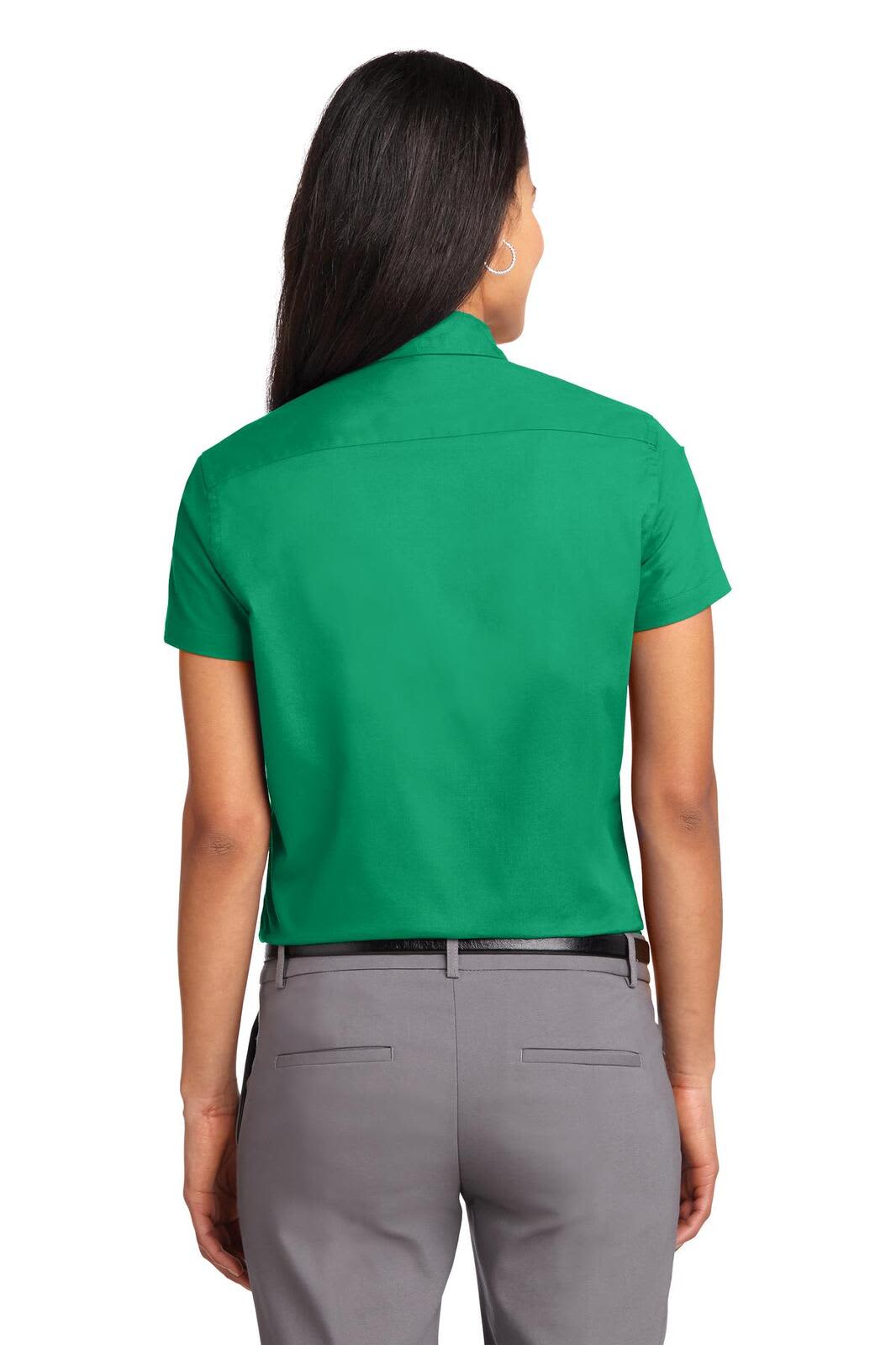 A green short sleeve button-up shirt with a collar, viewed from the back. It has a logo on the upper left side.