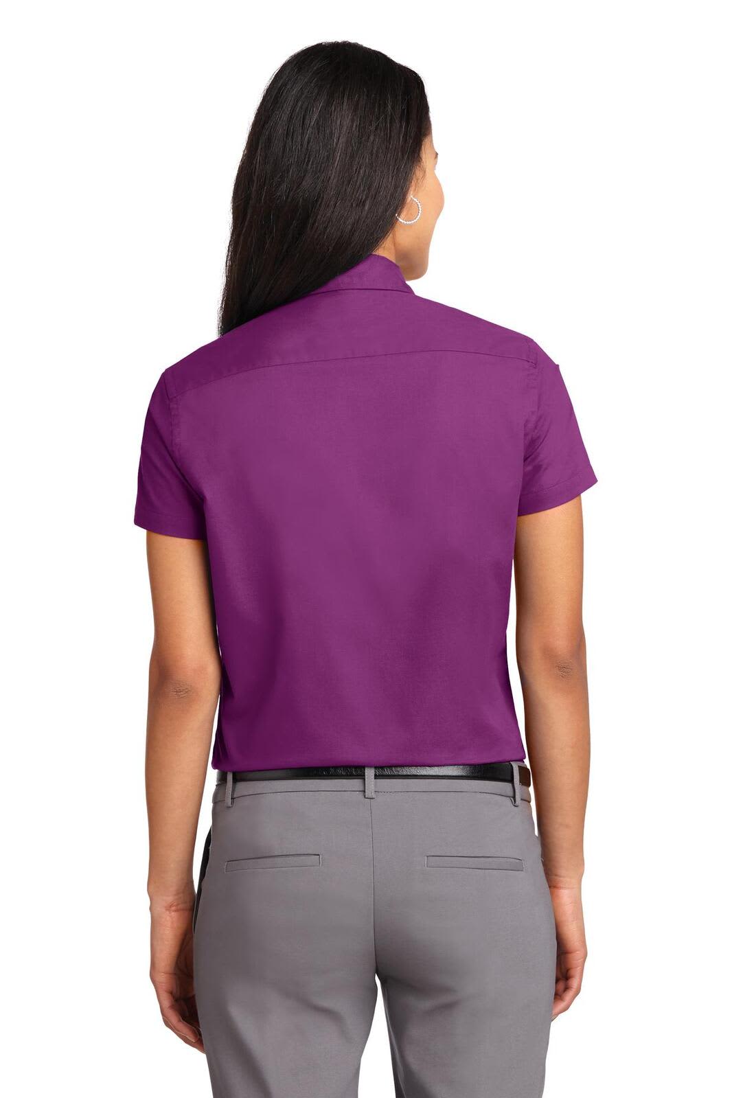 A purple short sleeve button-up shirt with a collar, featuring a logo on the back.