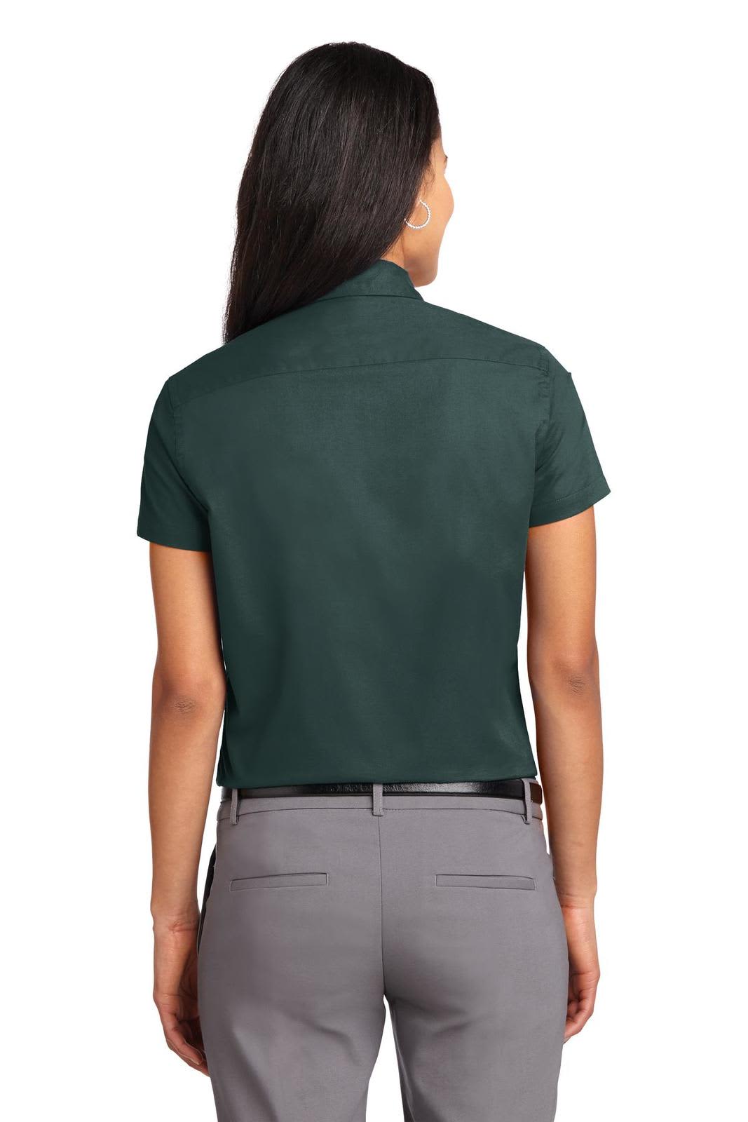A green short sleeve button-up shirt with a fitted design, featuring a logo on the back.