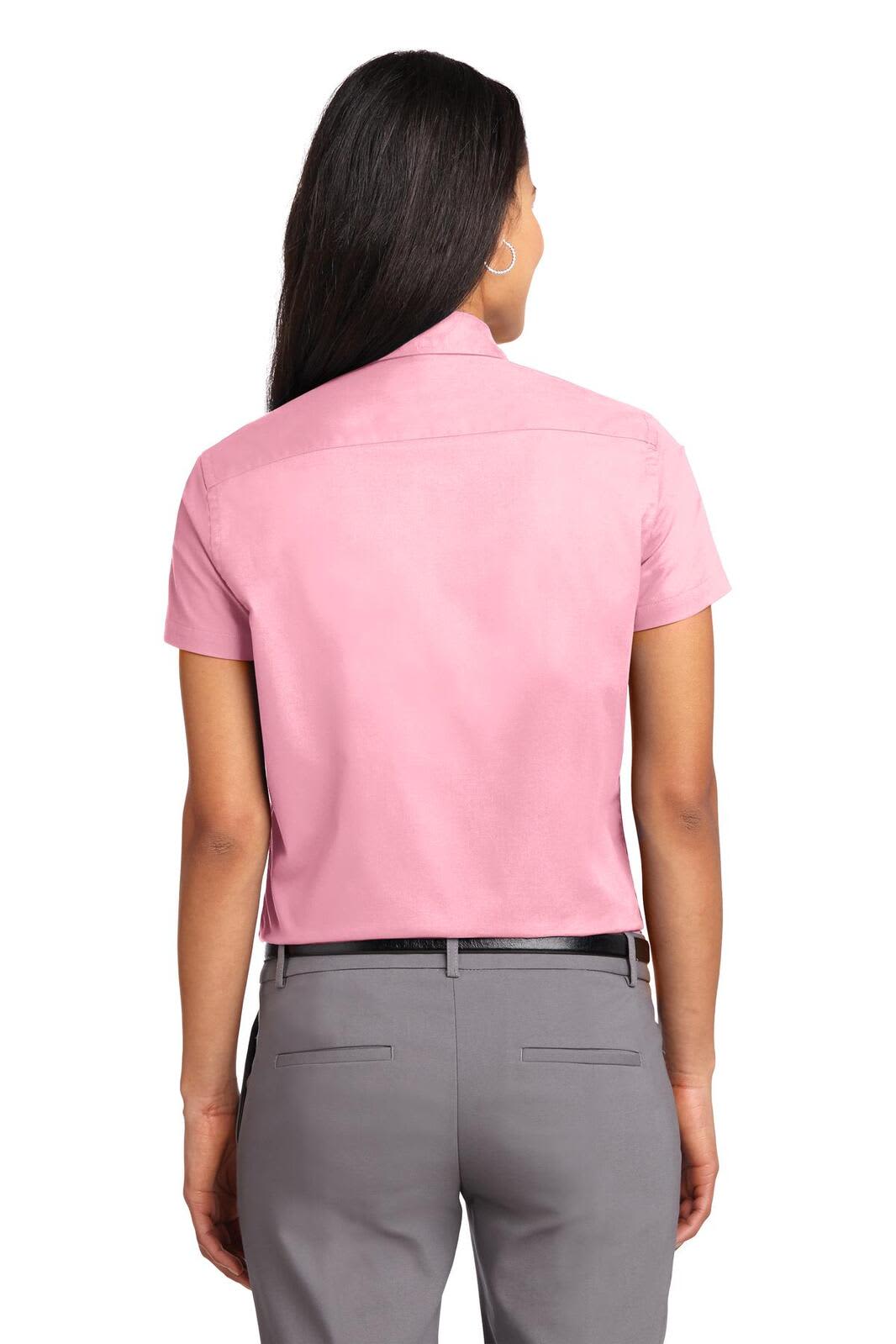 A short-sleeve ladies' button-up shirt in pink, featuring a back view and a logo.