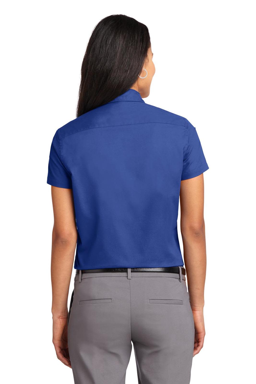 A short-sleeve button-up shirt in blue, featuring a classic collar and a branded logo. Back view with a fitted design.