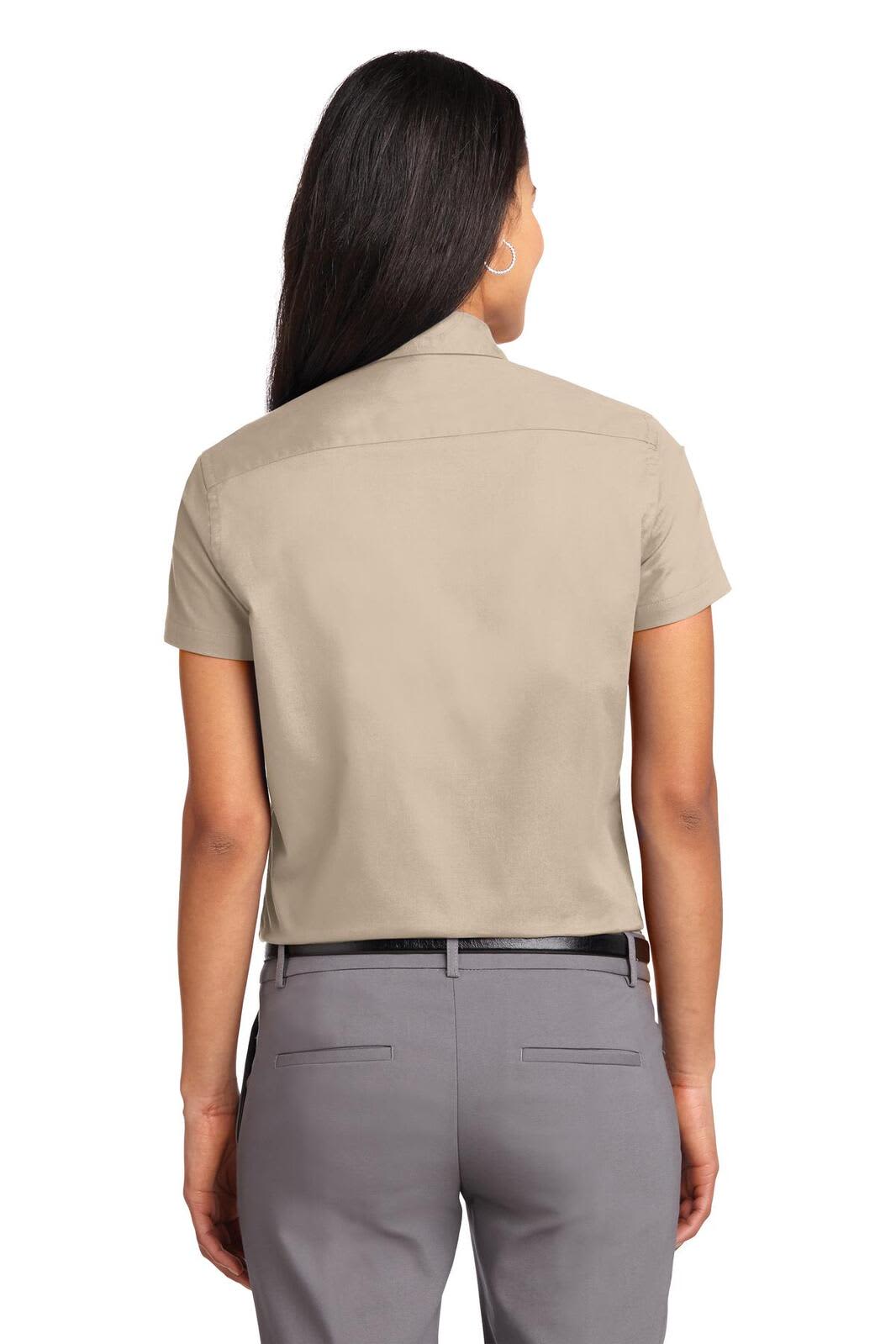 A short-sleeve beige button-up shirt with a collar, viewed from the back, featuring a logo.