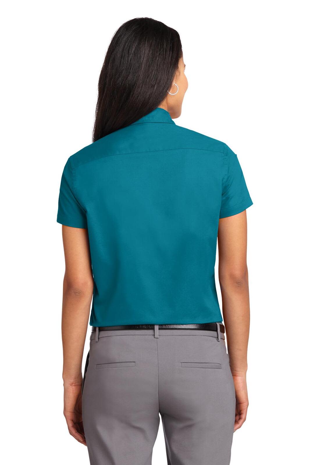A short sleeve button-up shirt in teal, featuring a back view and a simple collar design.