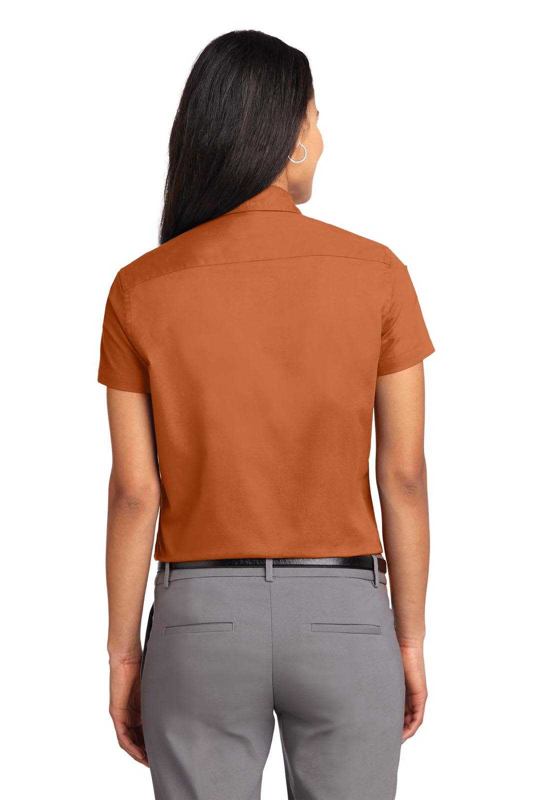 A short sleeve button-up shirt in orange with a tailored fit. The back view highlights its sleek design.