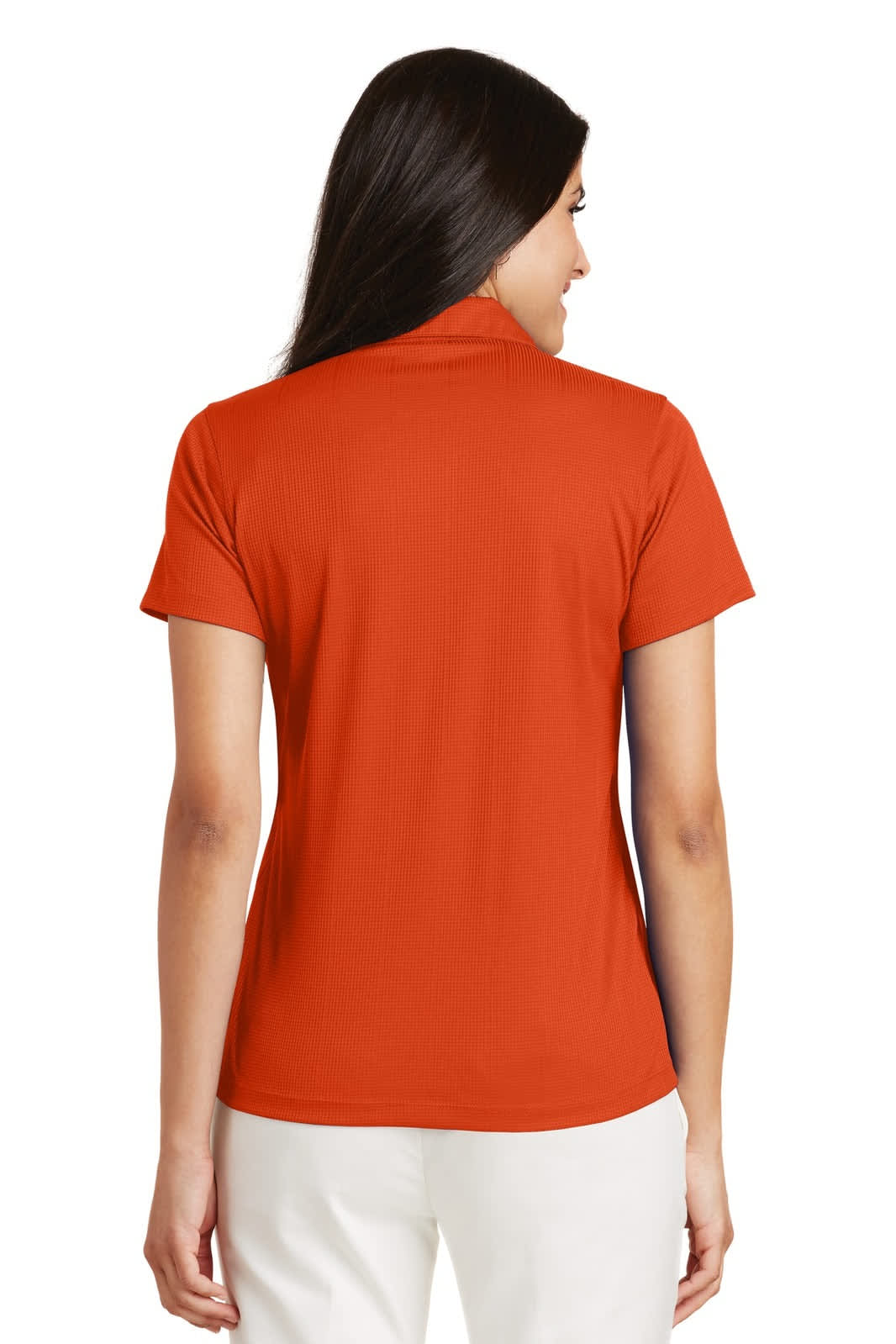 A back view of a women's performance polo shirt in vibrant orange. The shirt has a logo on the collar.