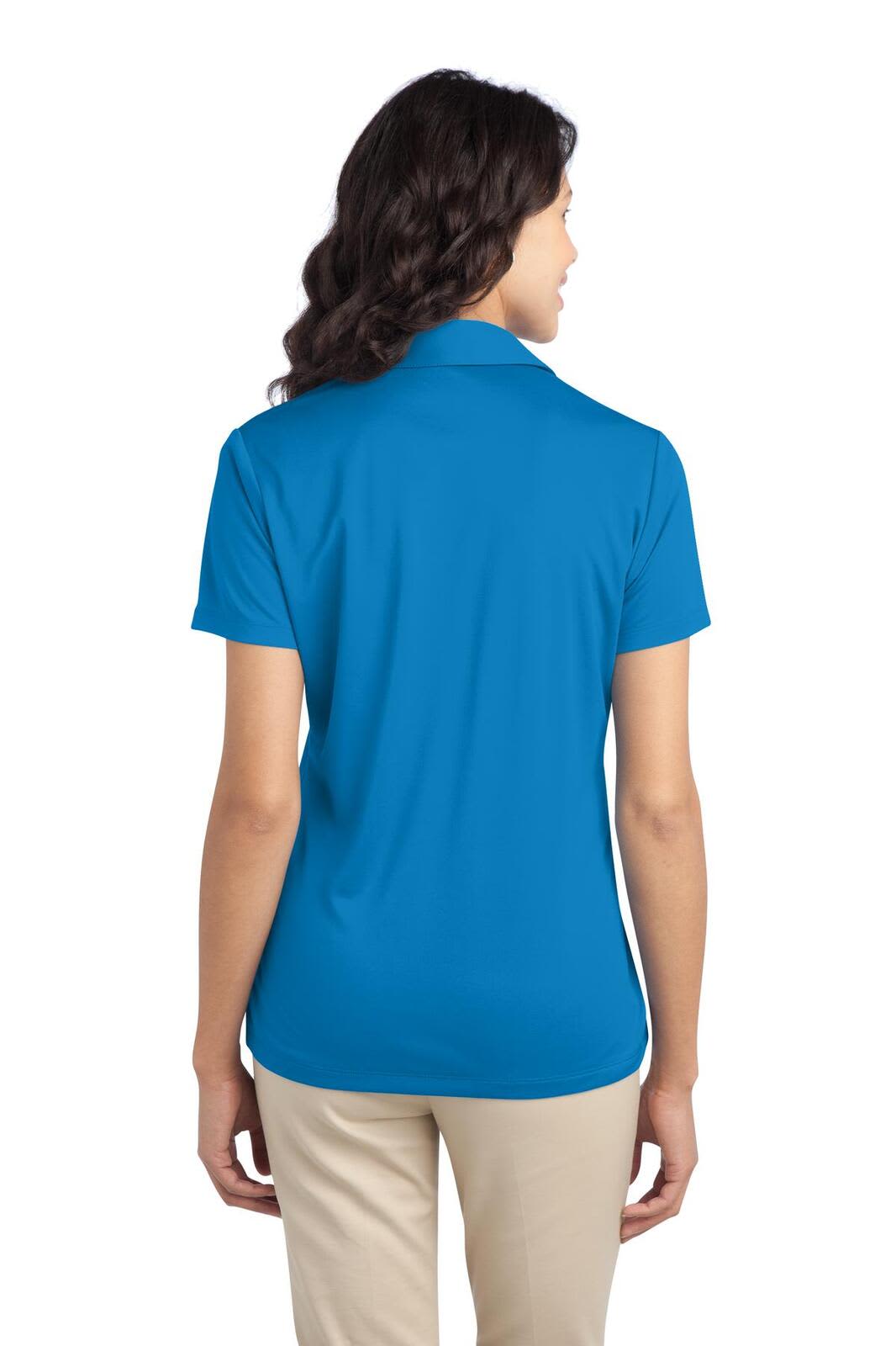 A woman wearing a back view of a bright blue polo shirt, featuring a collar and short sleeves.