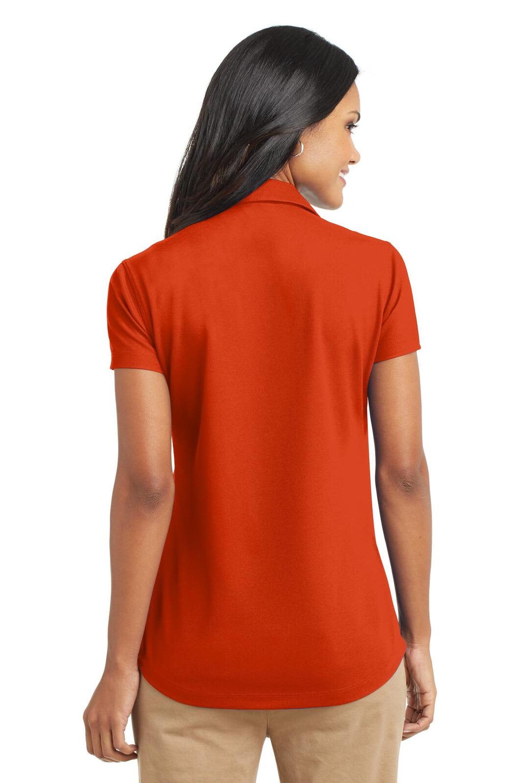 A red ladies' polo shirt with a collar, showcasing a back view and having a logo on the back.