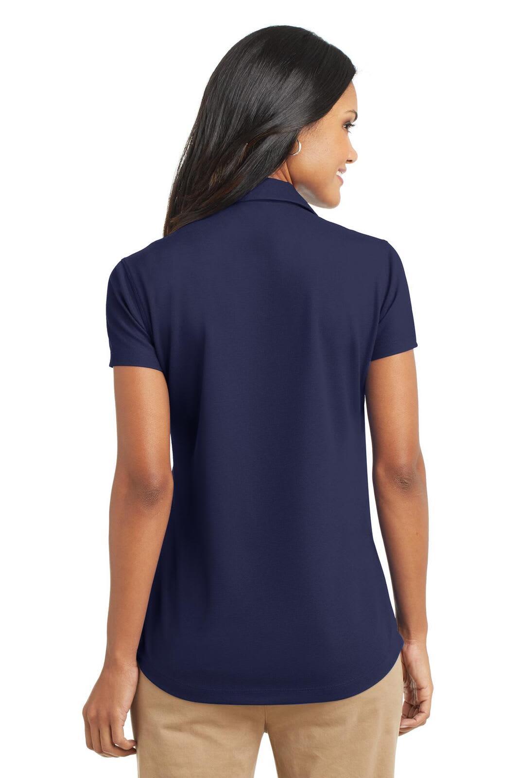 A navy blue ladies' polo shirt with a short sleeve and a subtle logo on the back.