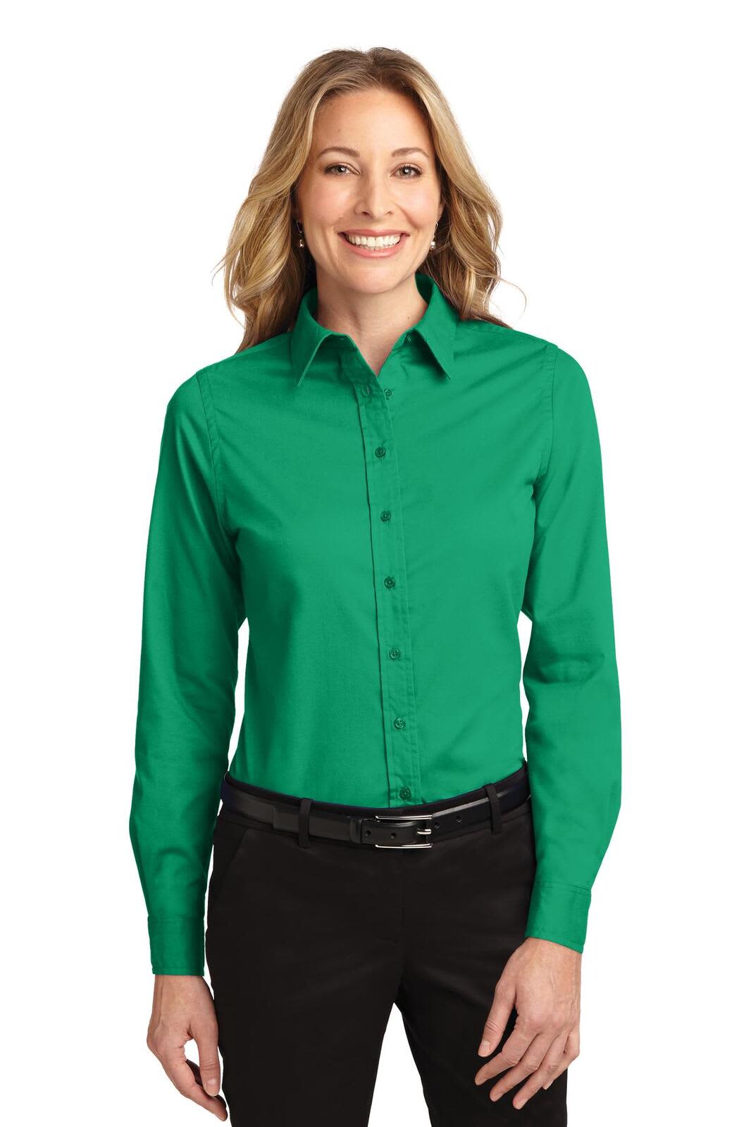 A green long sleeve button-up shirt for women, featuring a collared neck and a fitted design. Includes a logo.