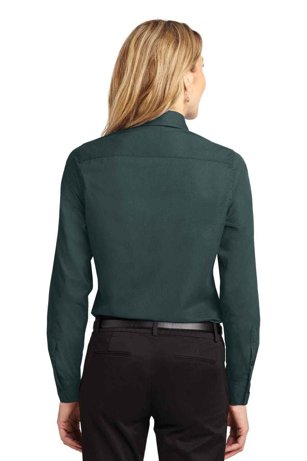 A long sleeve button-up shirt in a dark green colour, featuring a back yoke and a sleek design.