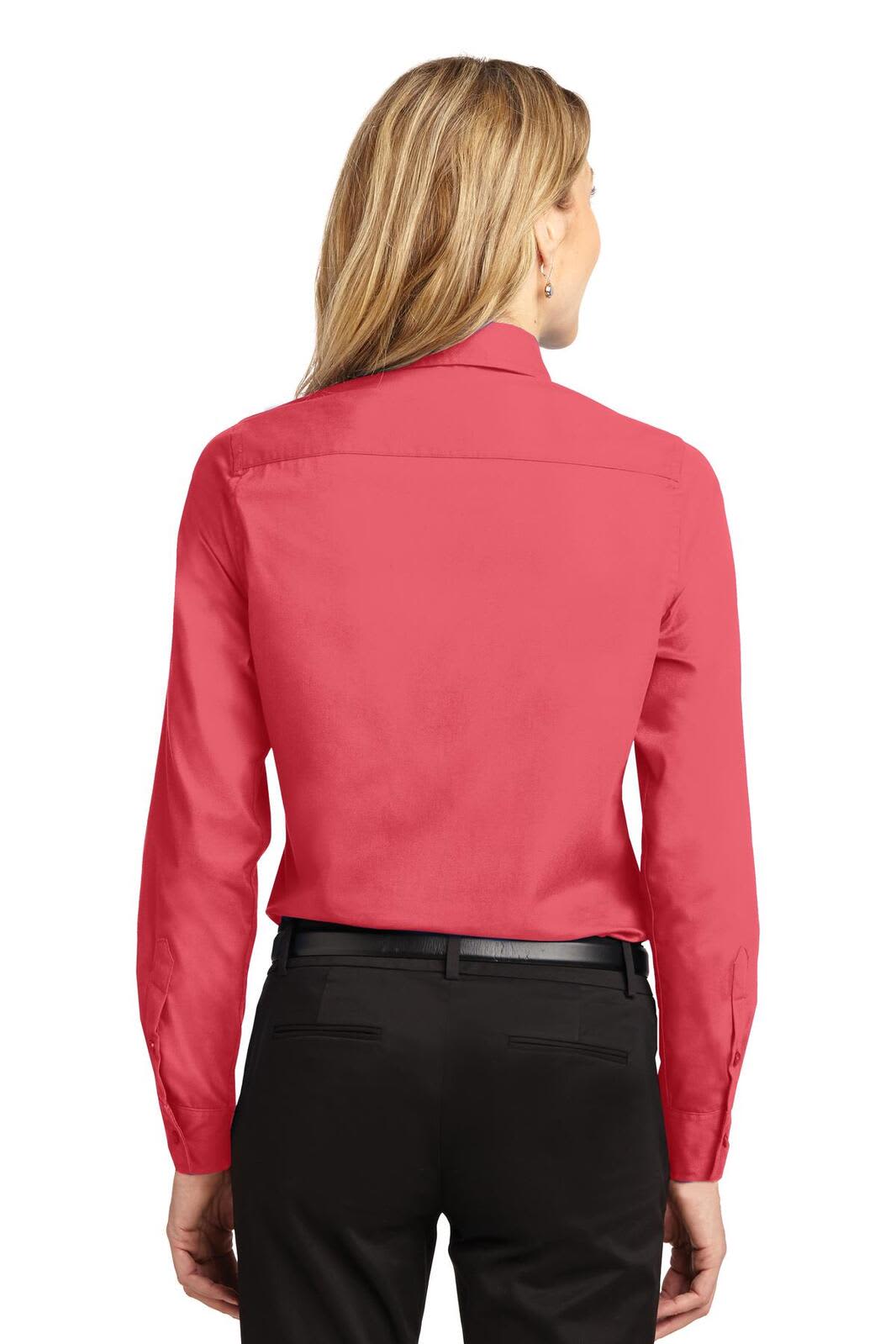A red long sleeve button-up shirt with a back collar and fitted silhouette, paired with dark trousers.