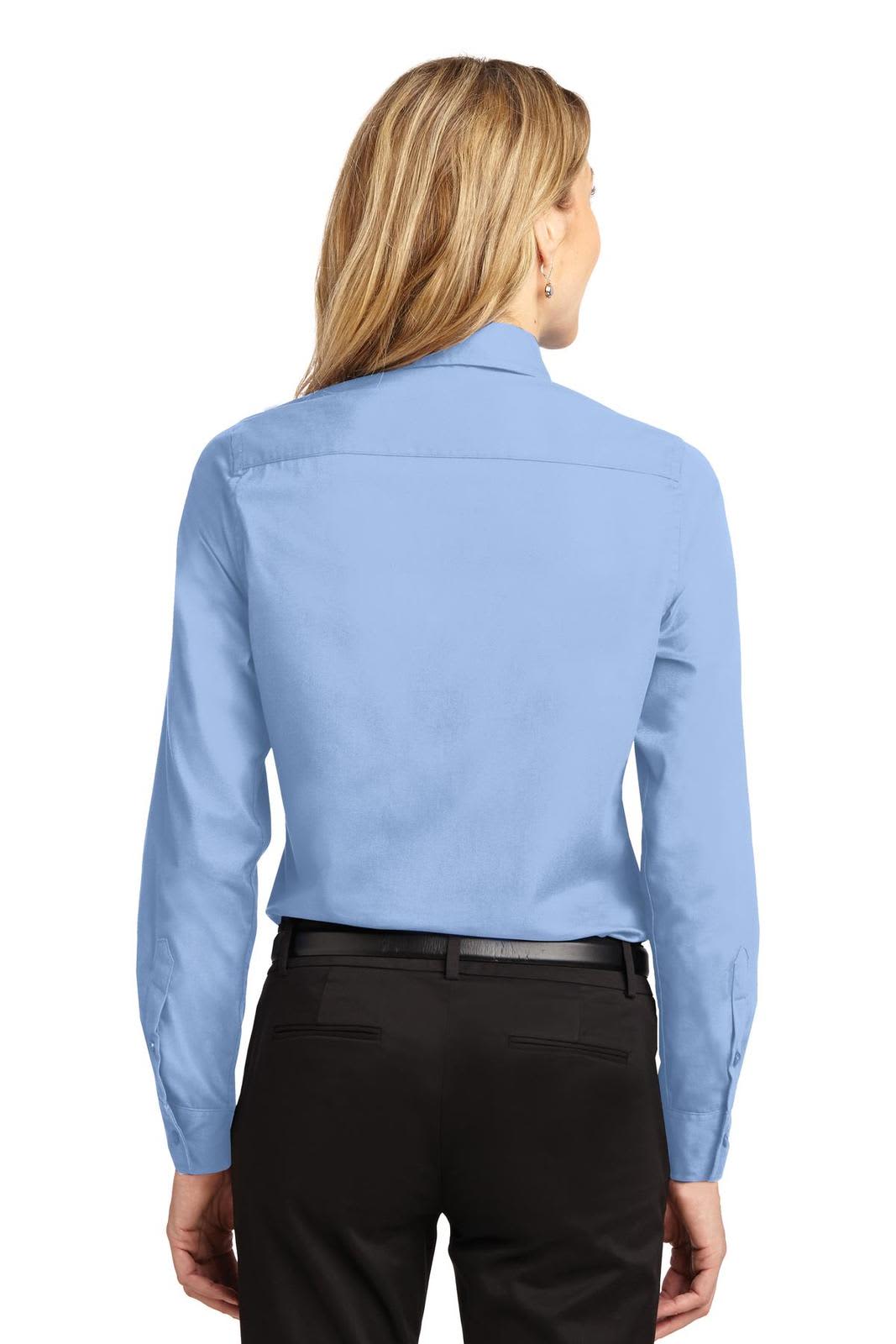 A light blue long sleeve button-up shirt with a standard collar, featuring an embroidered logo.