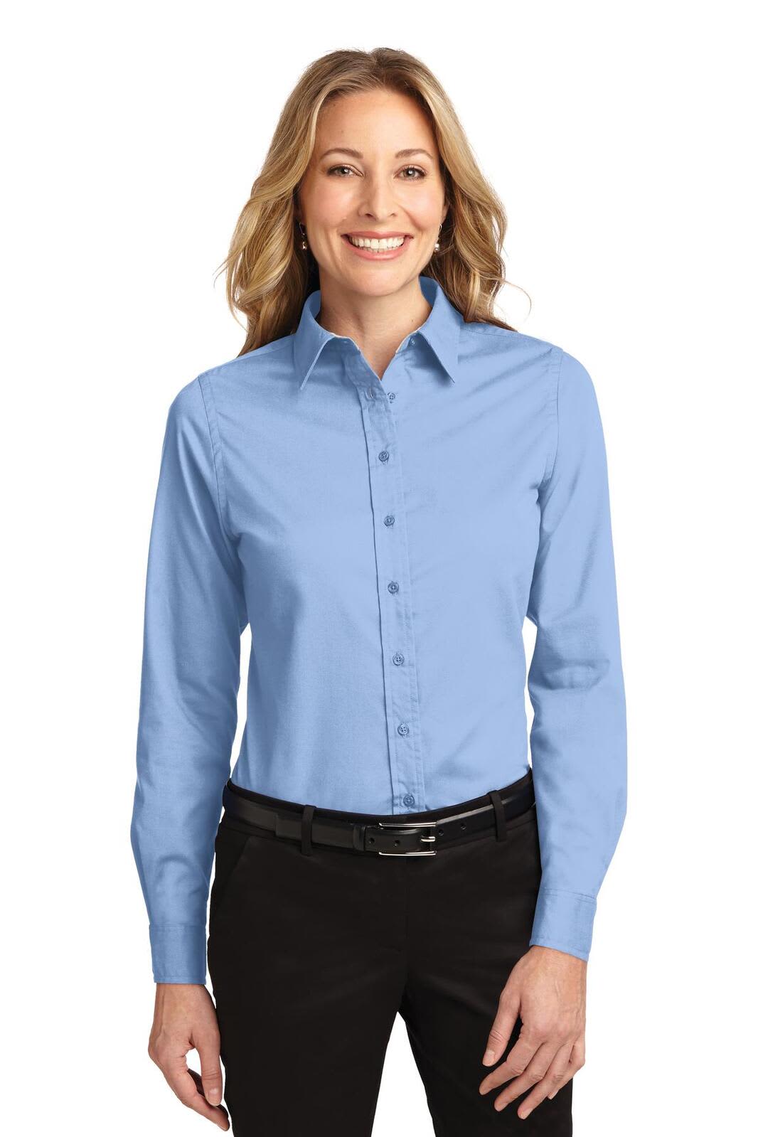 A light blue long sleeve button-up shirt for women, featuring a collar and a logo on the chest.