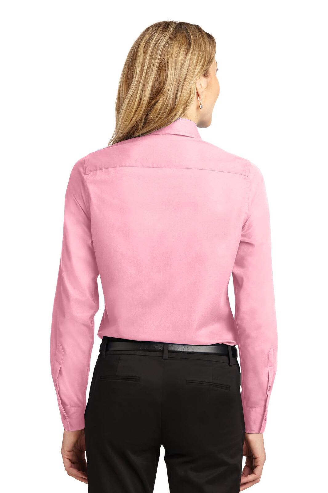 A pink long sleeve button-up shirt featuring a back yoke design and a logo.