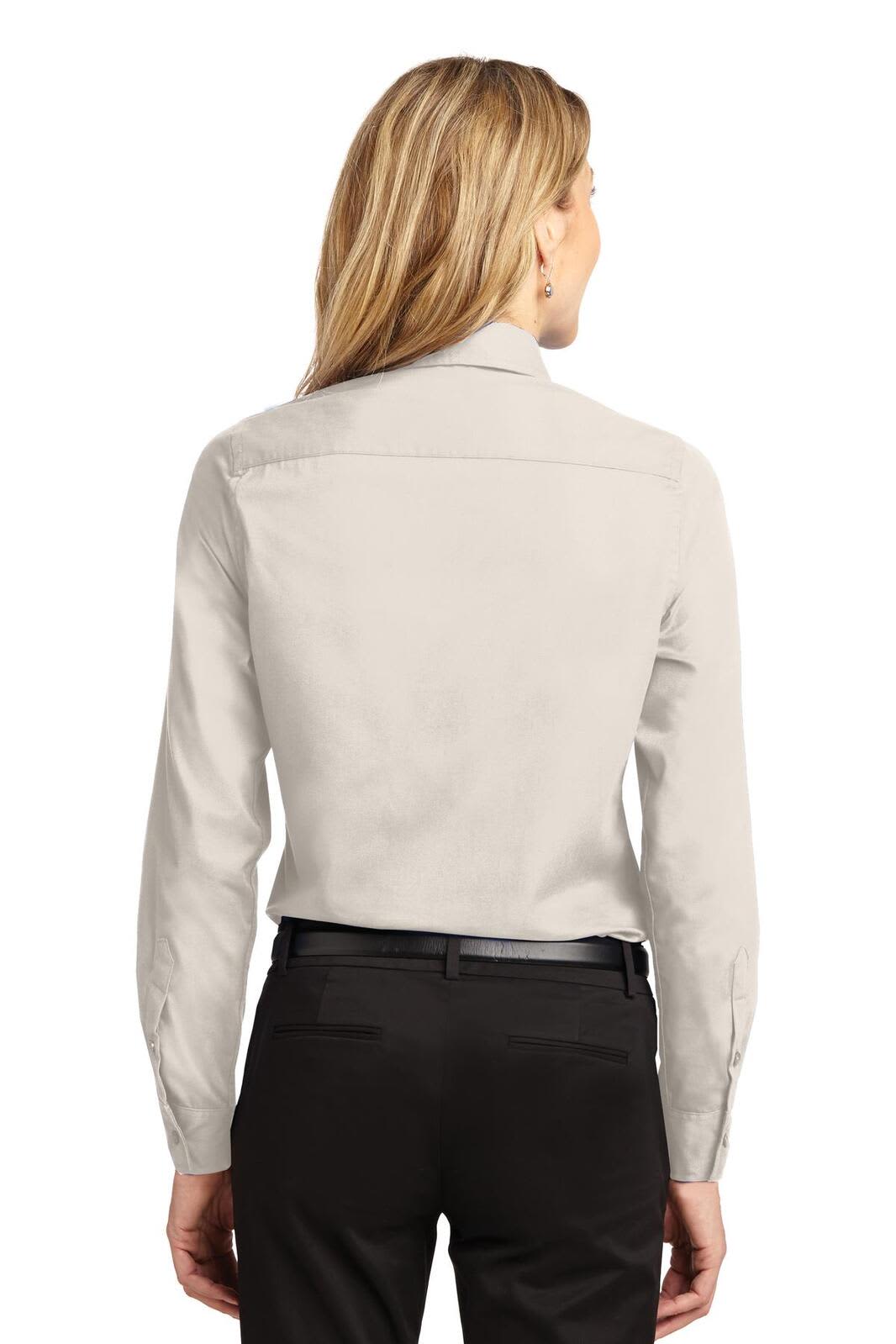 A light grey women's long sleeve button-up shirt with a back yoke and a fitted design. Features a logo on the shirt.