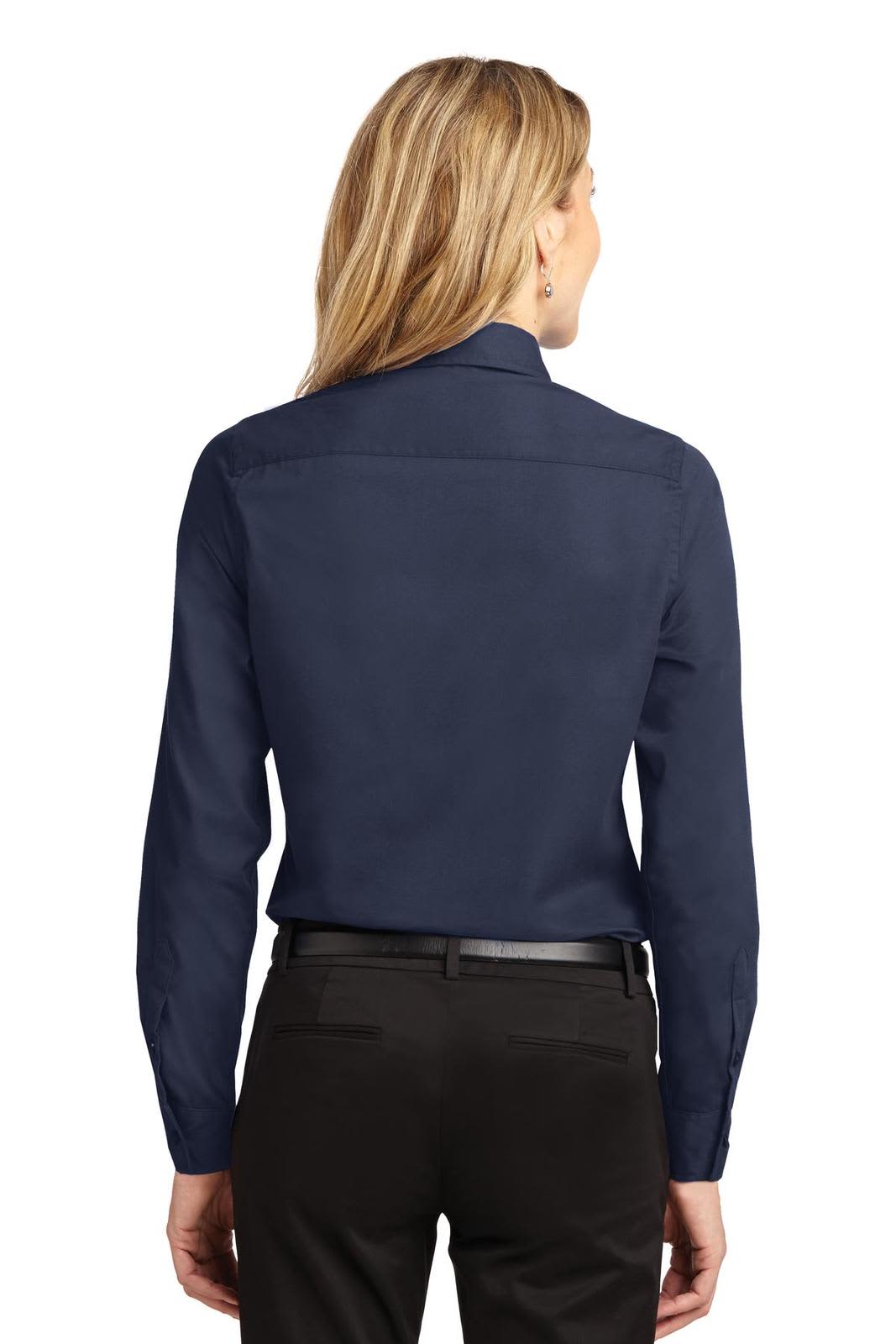A navy blue long sleeve button-up shirt with a collar, featuring a back yoke and a logo.