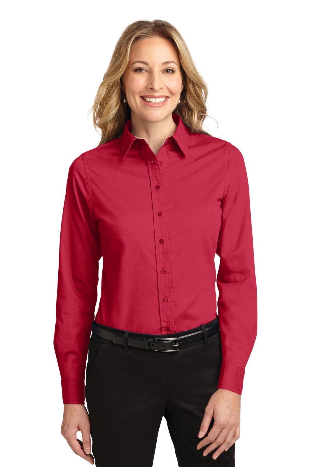 A long-sleeve, button-up shirt in red with a collar, featuring a logo on the chest and a woman wearing it.