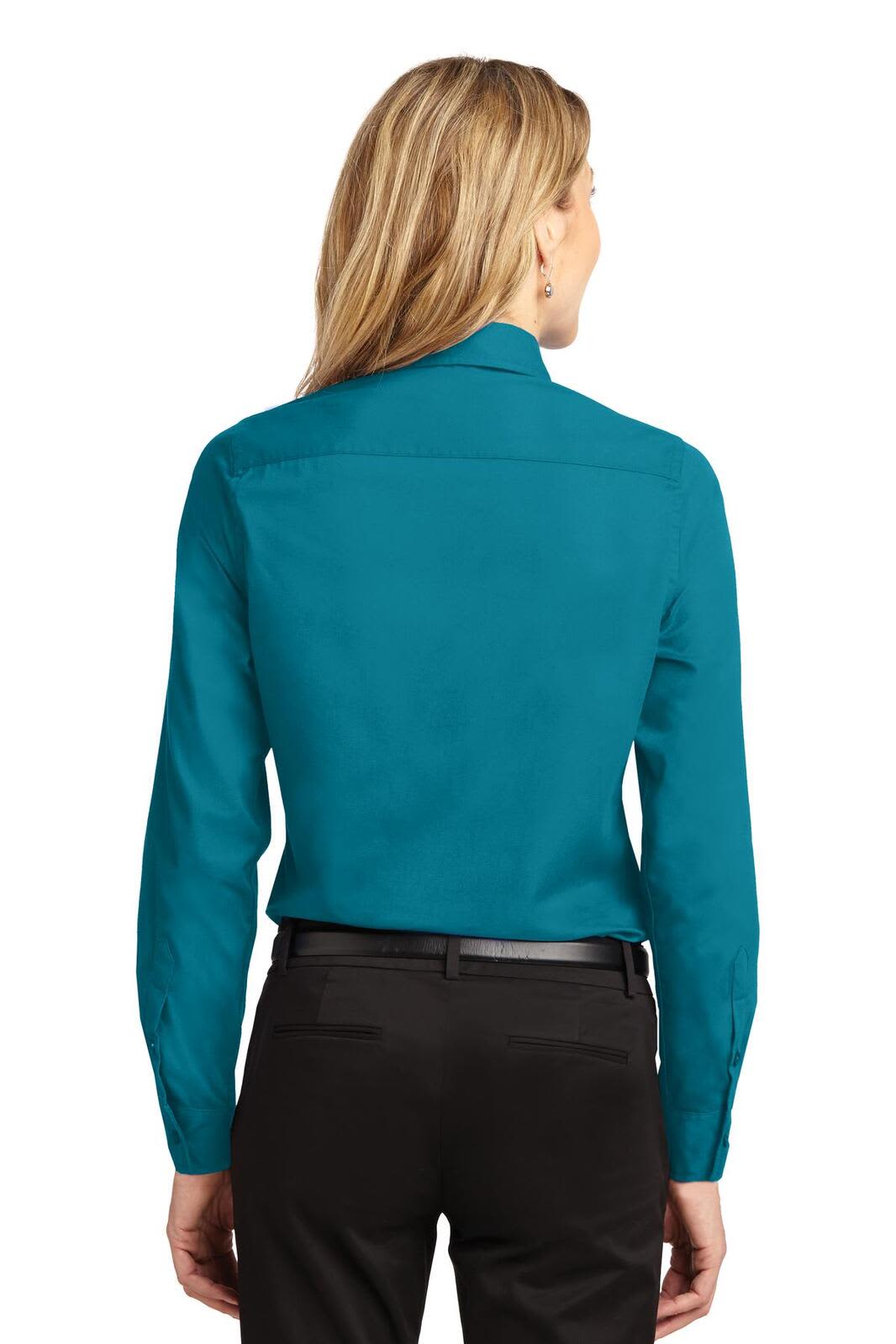 A long sleeve button-up shirt in a vibrant teal colour, featuring a collar and a back yoke design.