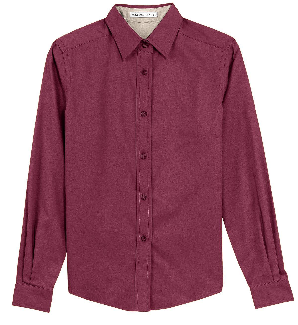 A maroon long sleeve button-up shirt with a collar and a logo on the label.