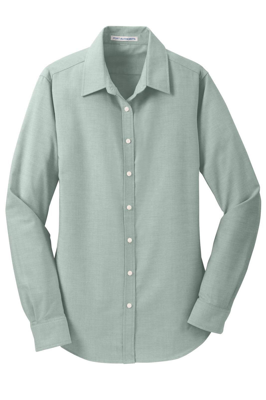 A button-up shirt in a soft mint green with a collar and long sleeves. Features a logo on the side.