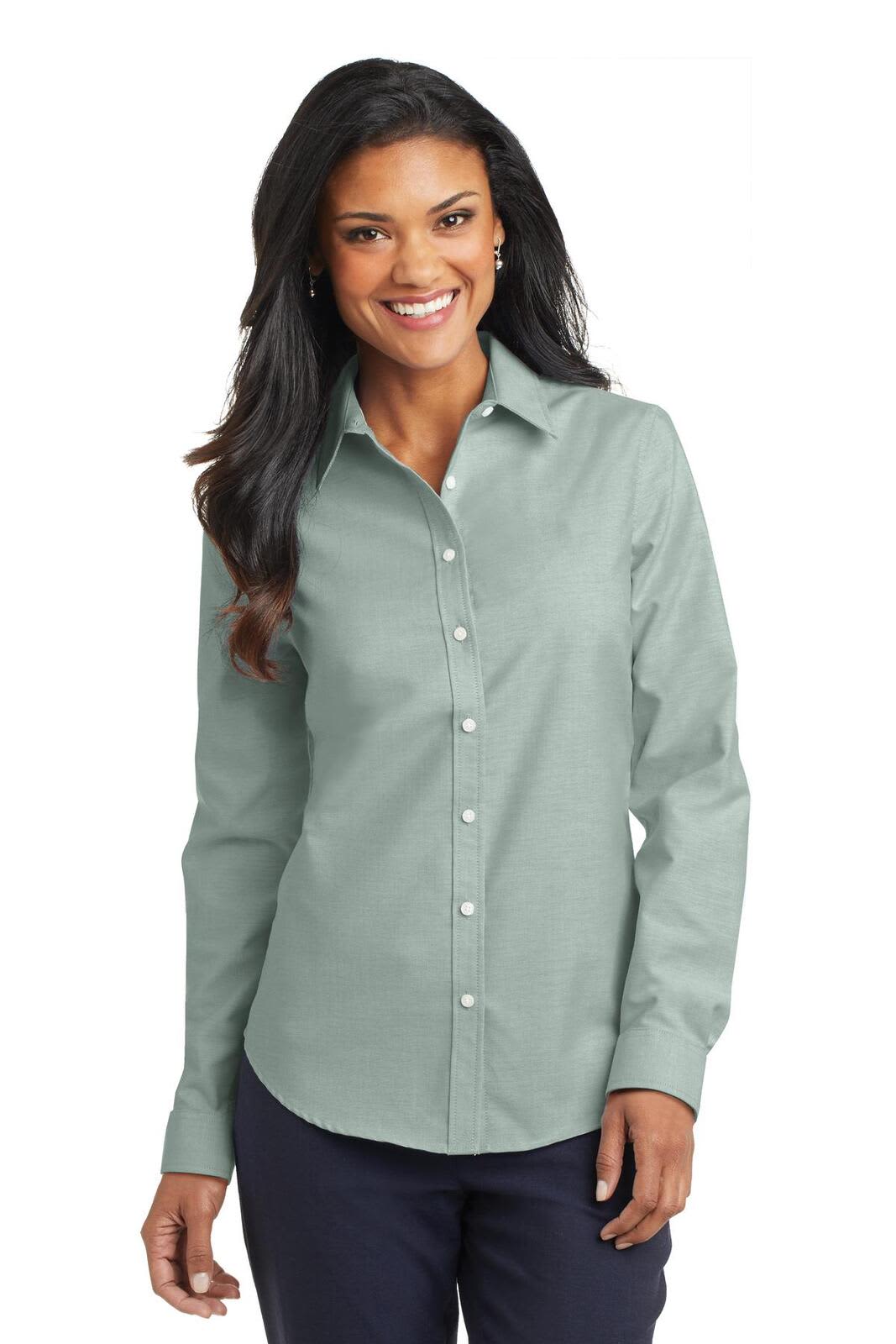 A light green button-up shirt with a collar and long sleeves, featuring a logo on the chest.