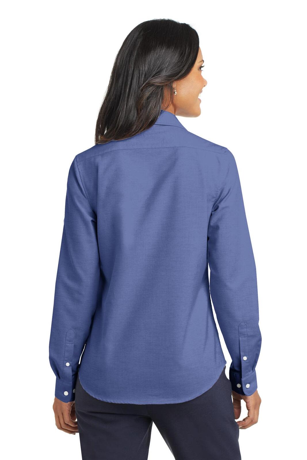 A back view of a blue button-up shirt with long sleeves and a collar, featuring a logo.