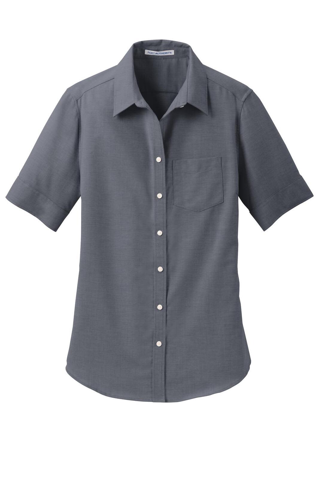 A grey short sleeve button-up shirt with a collar and a chest pocket, featuring a logo.