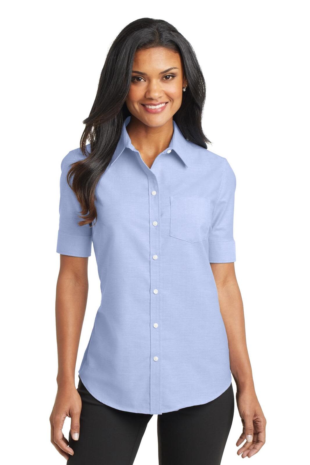 A light blue short sleeve button-up shirt with a collar, featuring a pocket and a logo.