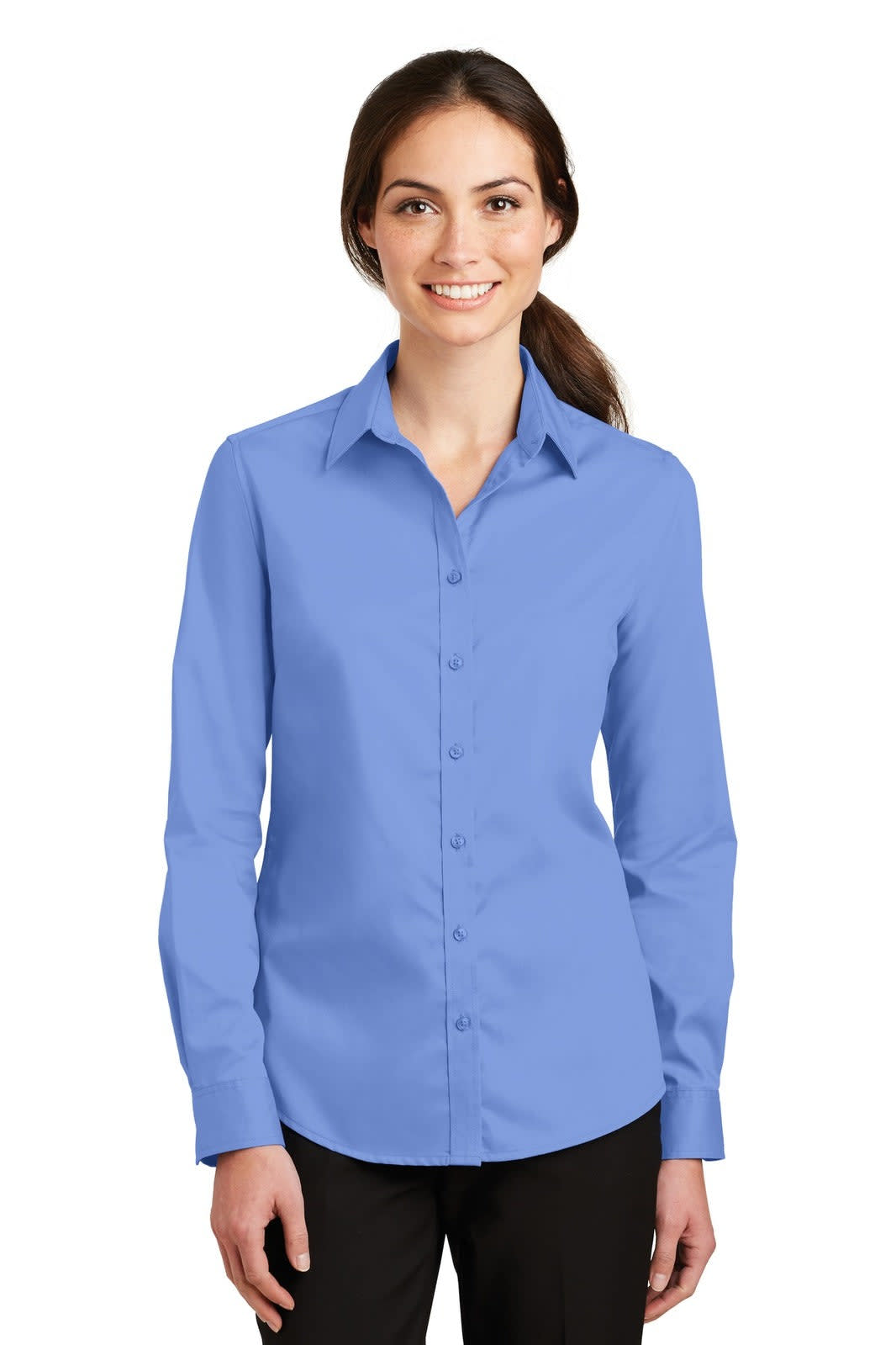 A light blue button-up shirt with long sleeves and a collar, featuring a logo on the chest.