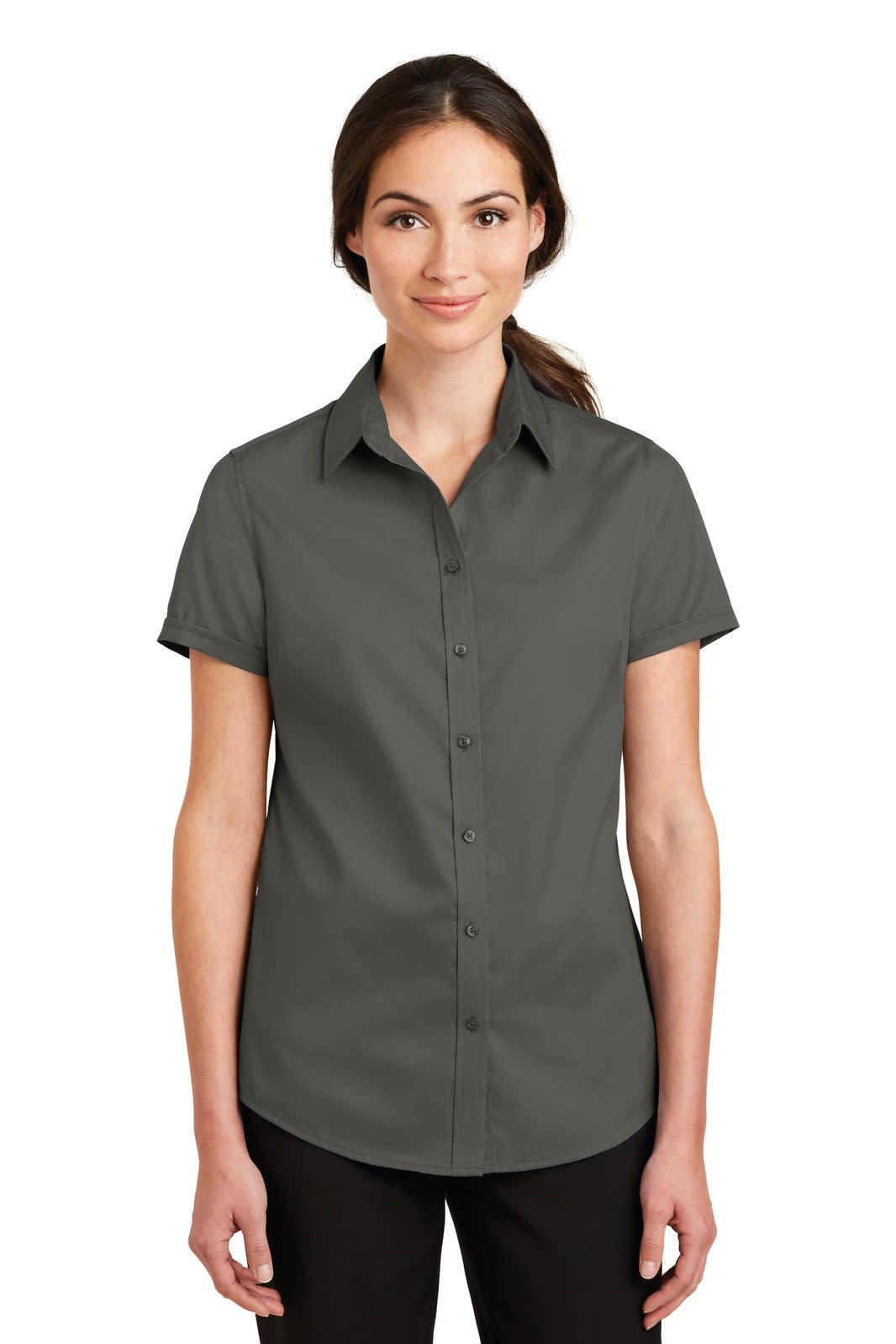 A woman wearing a short sleeve, dark grey button-up shirt with a collar. The shirt has a logo on it.