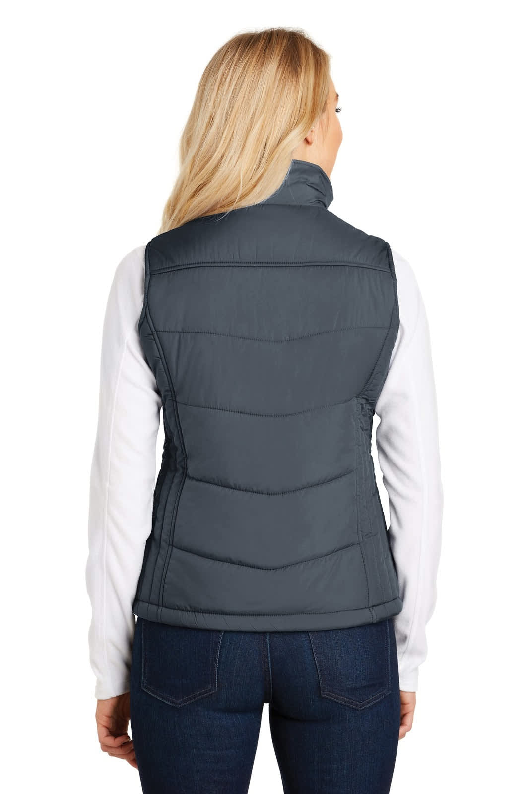 A grey puffy vest with a high collar, featuring a logo, viewed from the back on a model wearing a white top.