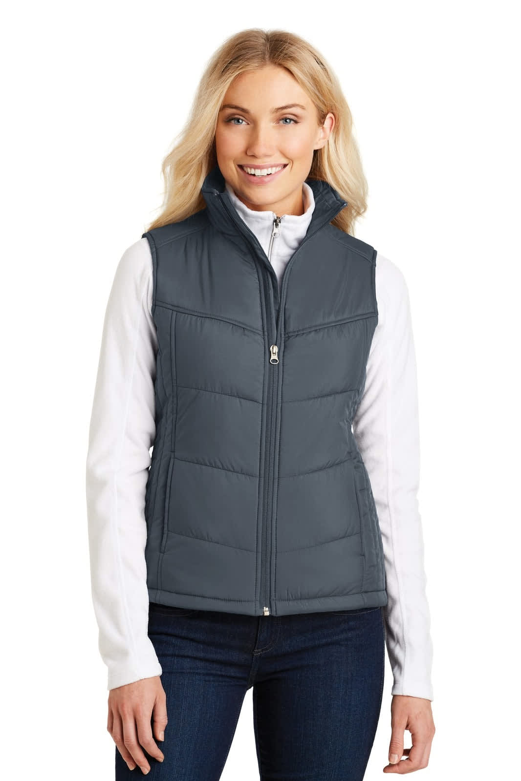 A grey ladies' puffy vest with a front zip, featuring a blank logo on the chest and worn over a white top.