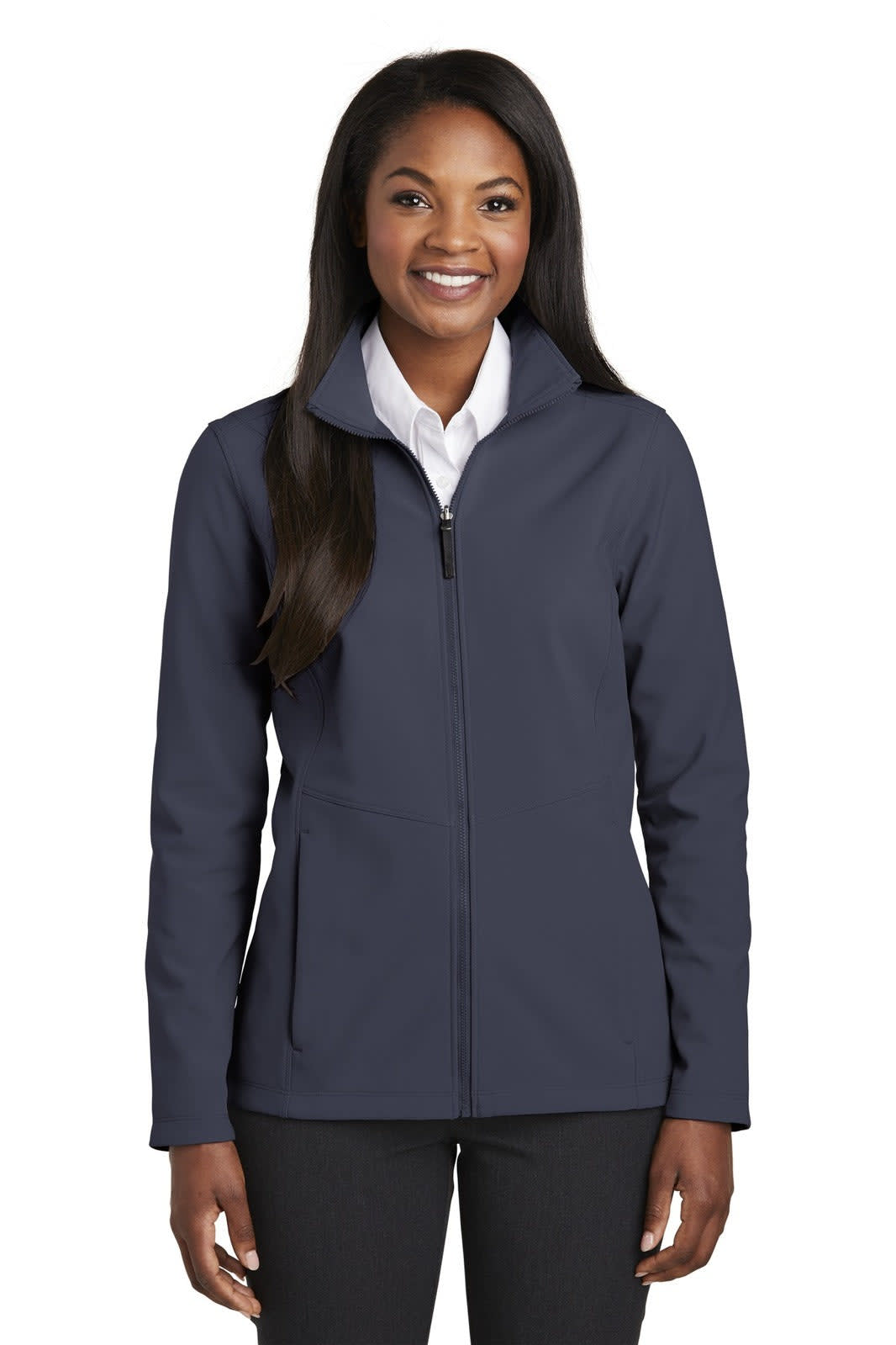 A woman wearing a navy soft shell jacket with a zip and front pockets, accompanied by a white shirt.