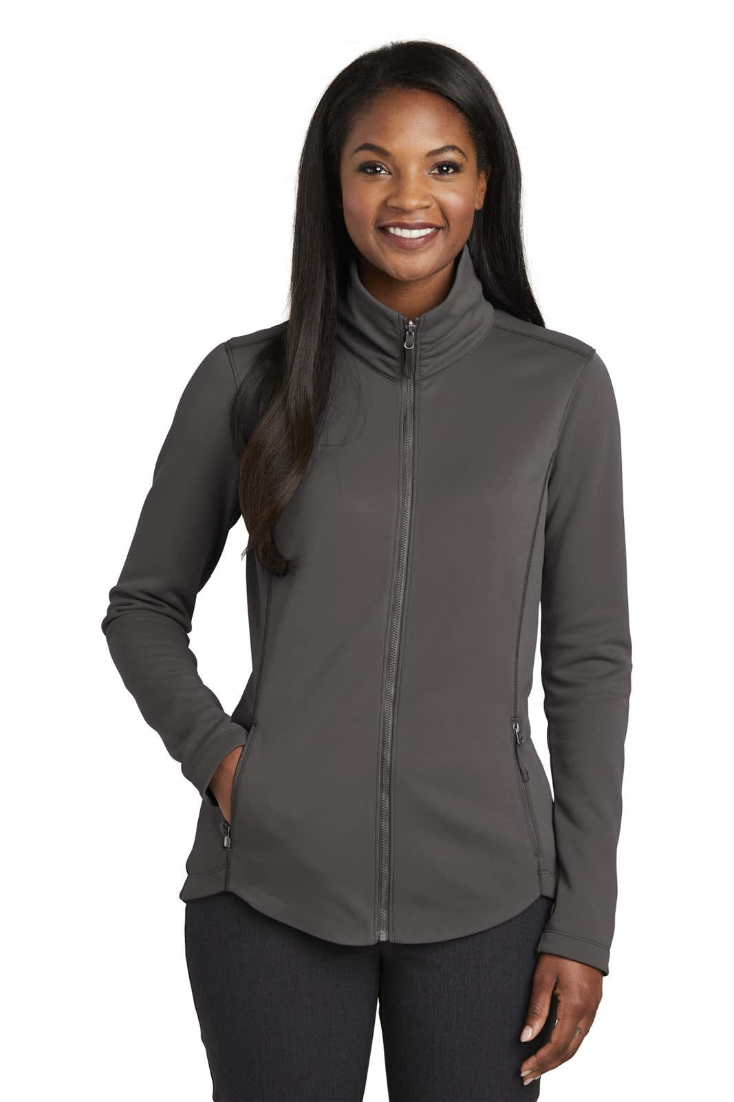 A grey fleece jacket with a zippered front and side pockets, worn by a smiling woman.