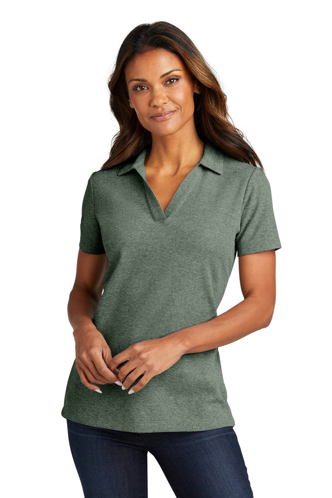 A lady wearing a green polo shirt with a collar, standing in front of a plain background. The shirt has a branding logo.