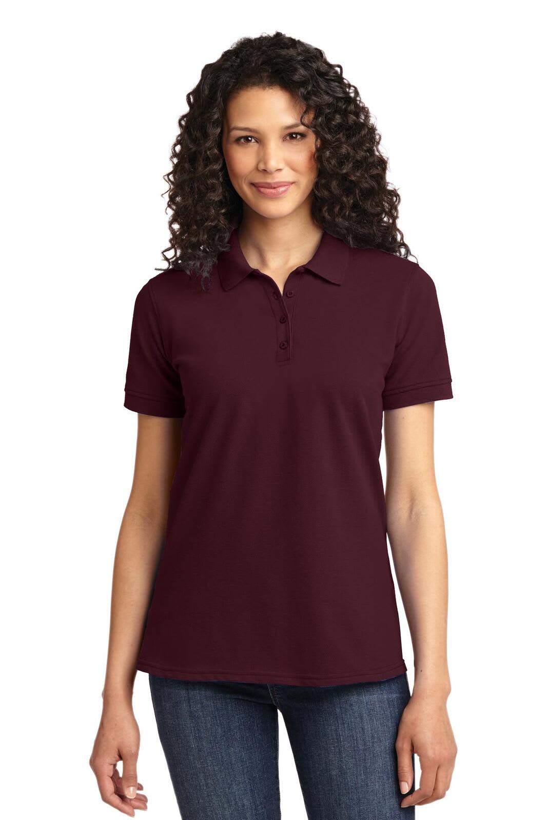A maroon women's polo shirt with short sleeves and a collar, featuring a branding logo.