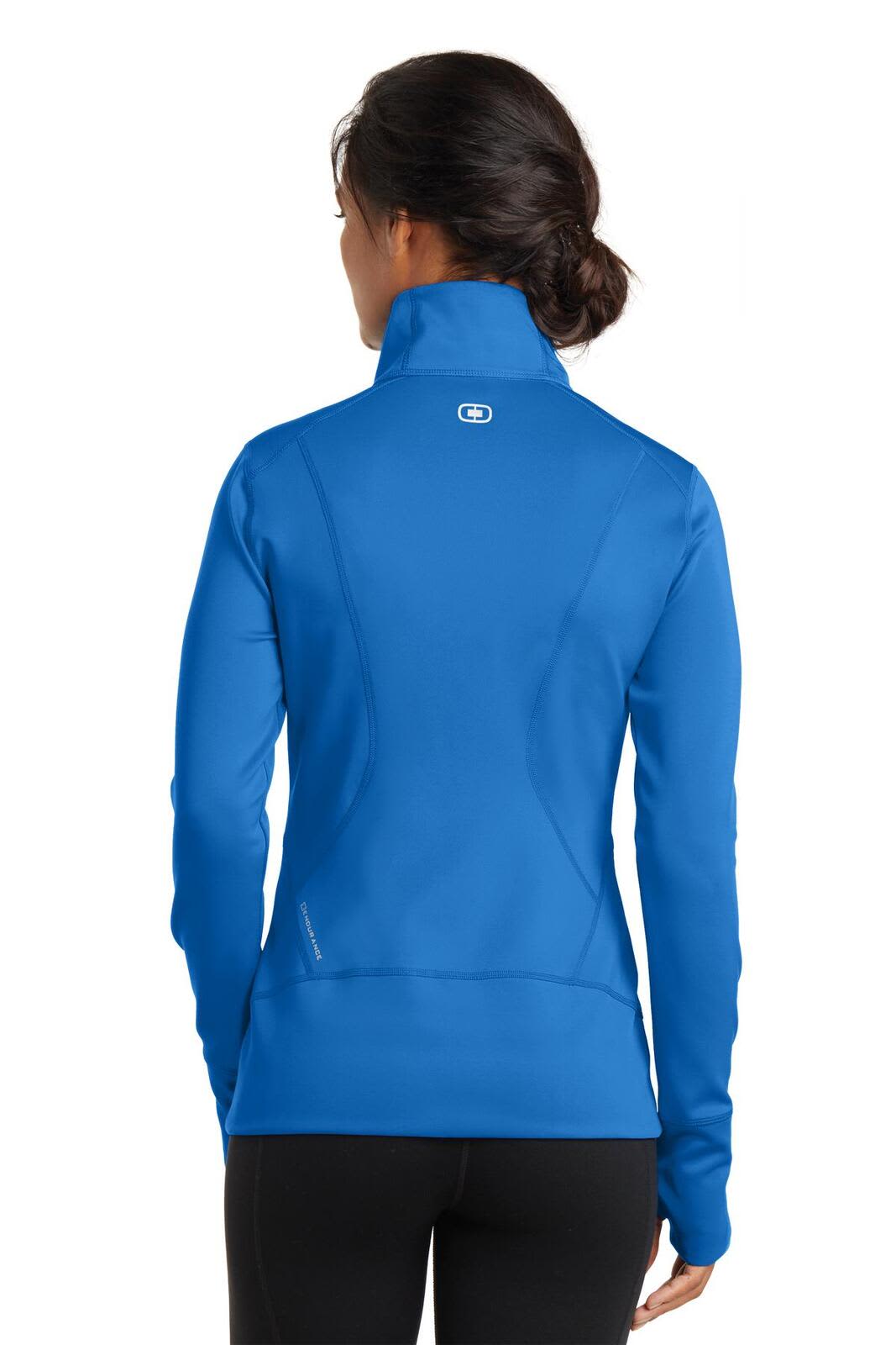 A women's blue full-zip jumper with a high collar, showcasing a fitted silhouette and featuring a logo.