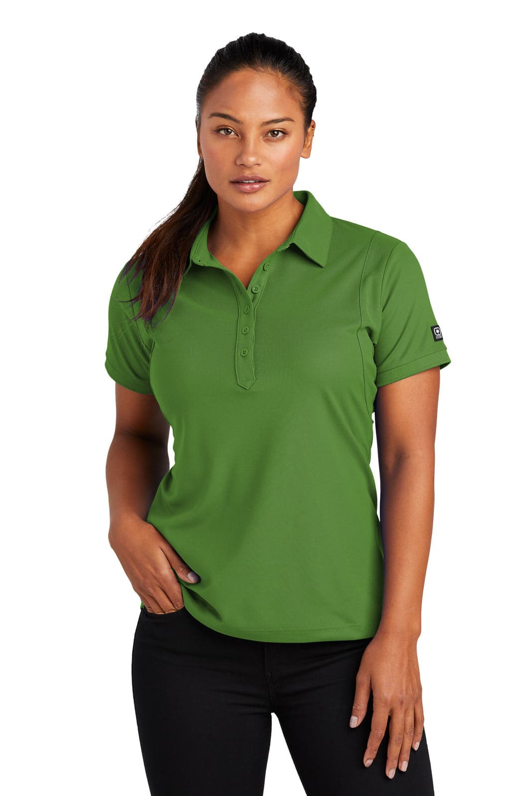 A green polo shirt featuring a collar and short sleeves, with a logo on the sleeve.