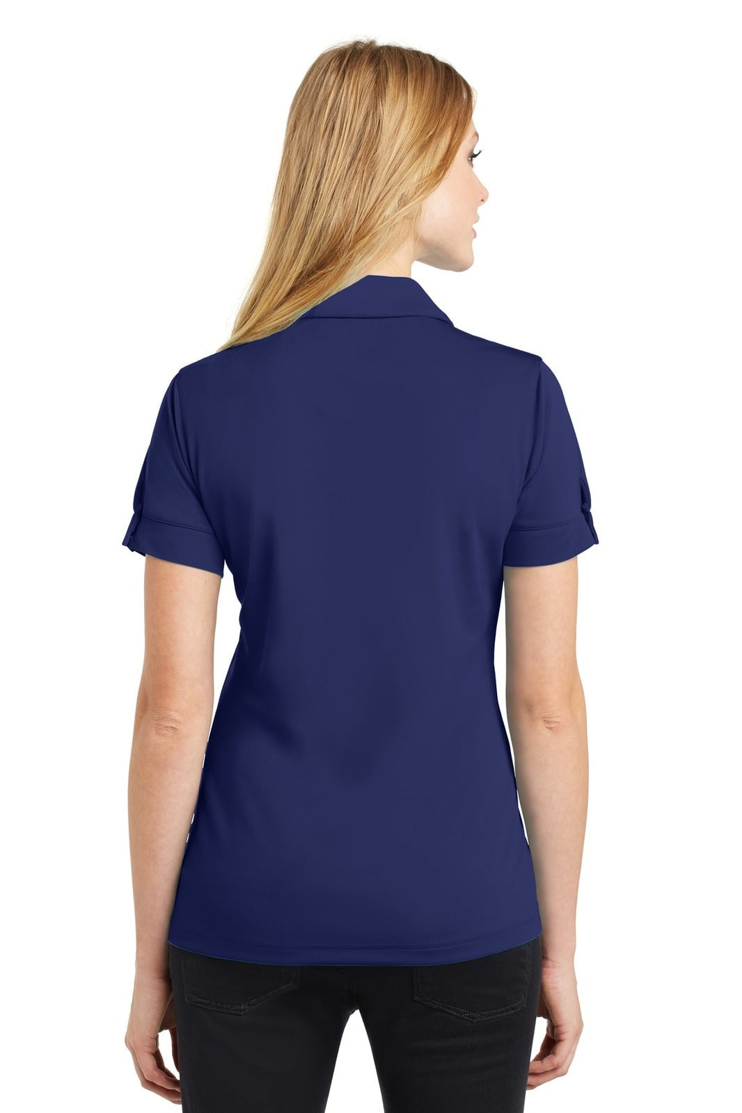 A navy polo shirt is displayed, featuring short sleeves and a collar, with a brand logo on the sleeve.
