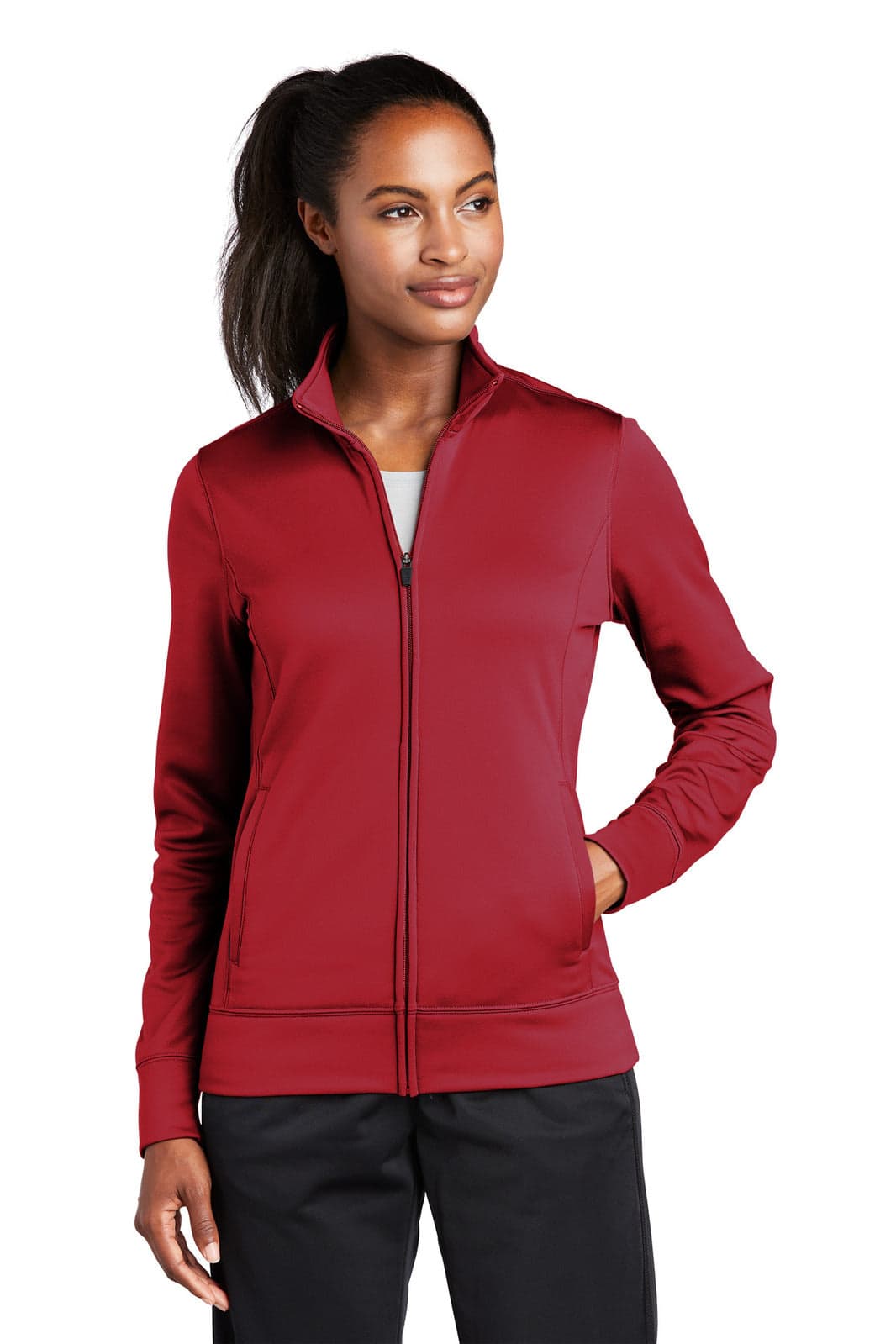 A red full-zip fleece jacket with long sleeves and a zippered front, featuring a logo.