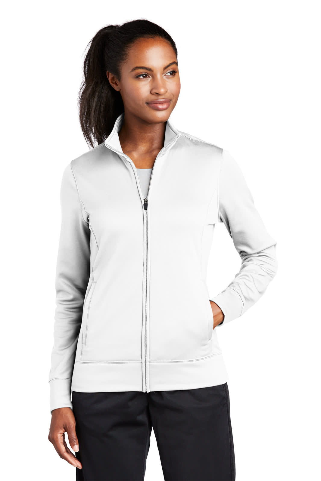 A light grey full-zip fleece jacket for women, featuring a sleek design and fitted silhouette. It has a logo on it.