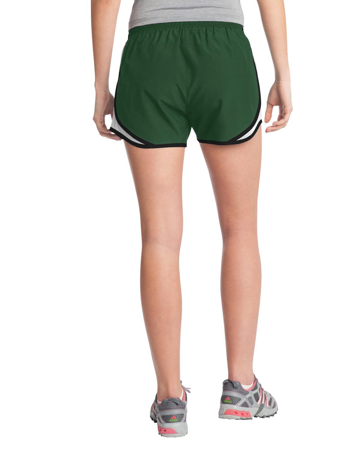 A pair of green ladies sports shorts with black accents, featuring a logo.